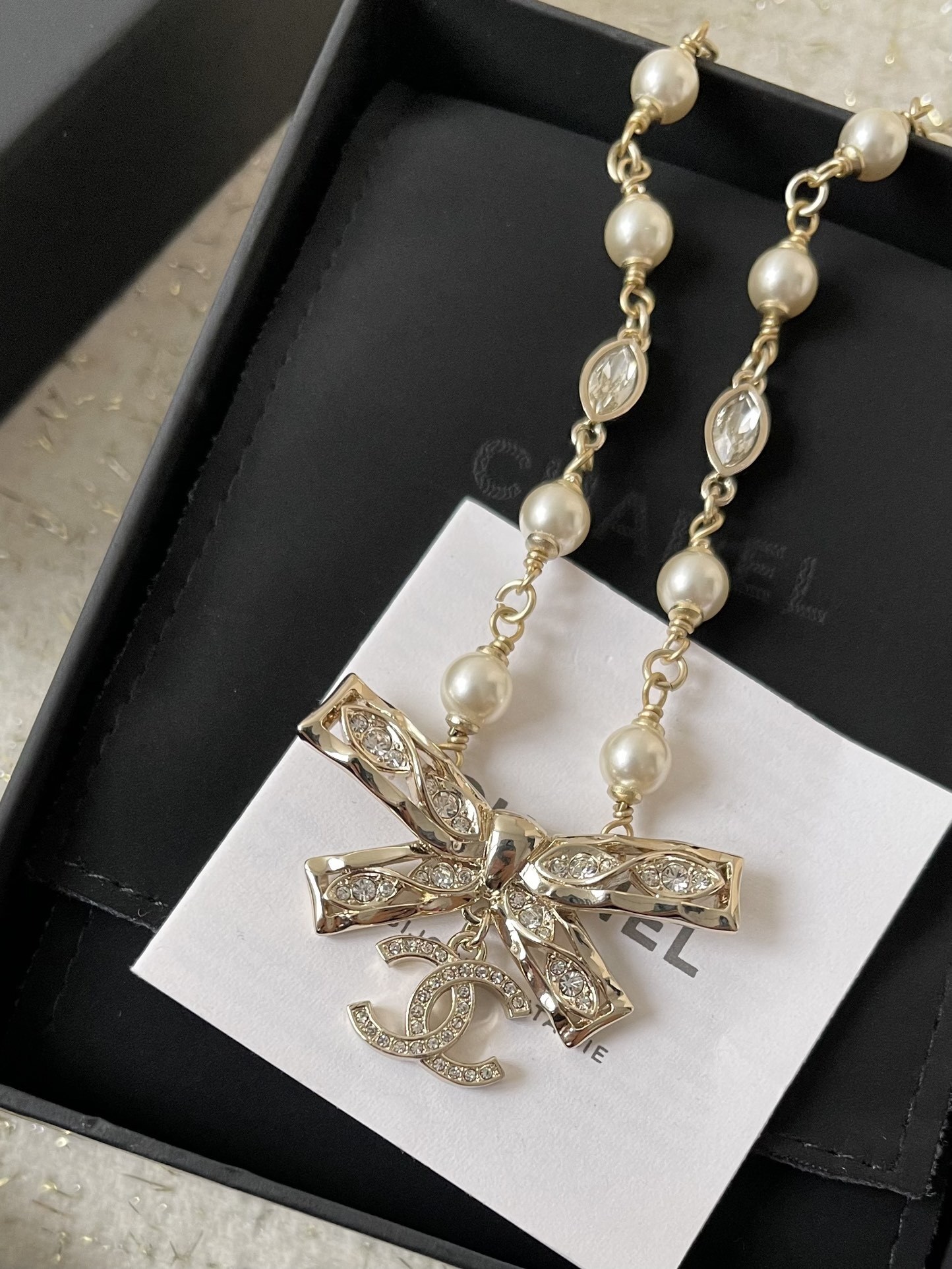 Chanel Crystal Bow Pearl Necklace - Elegant CC Logo Jewelry for Women