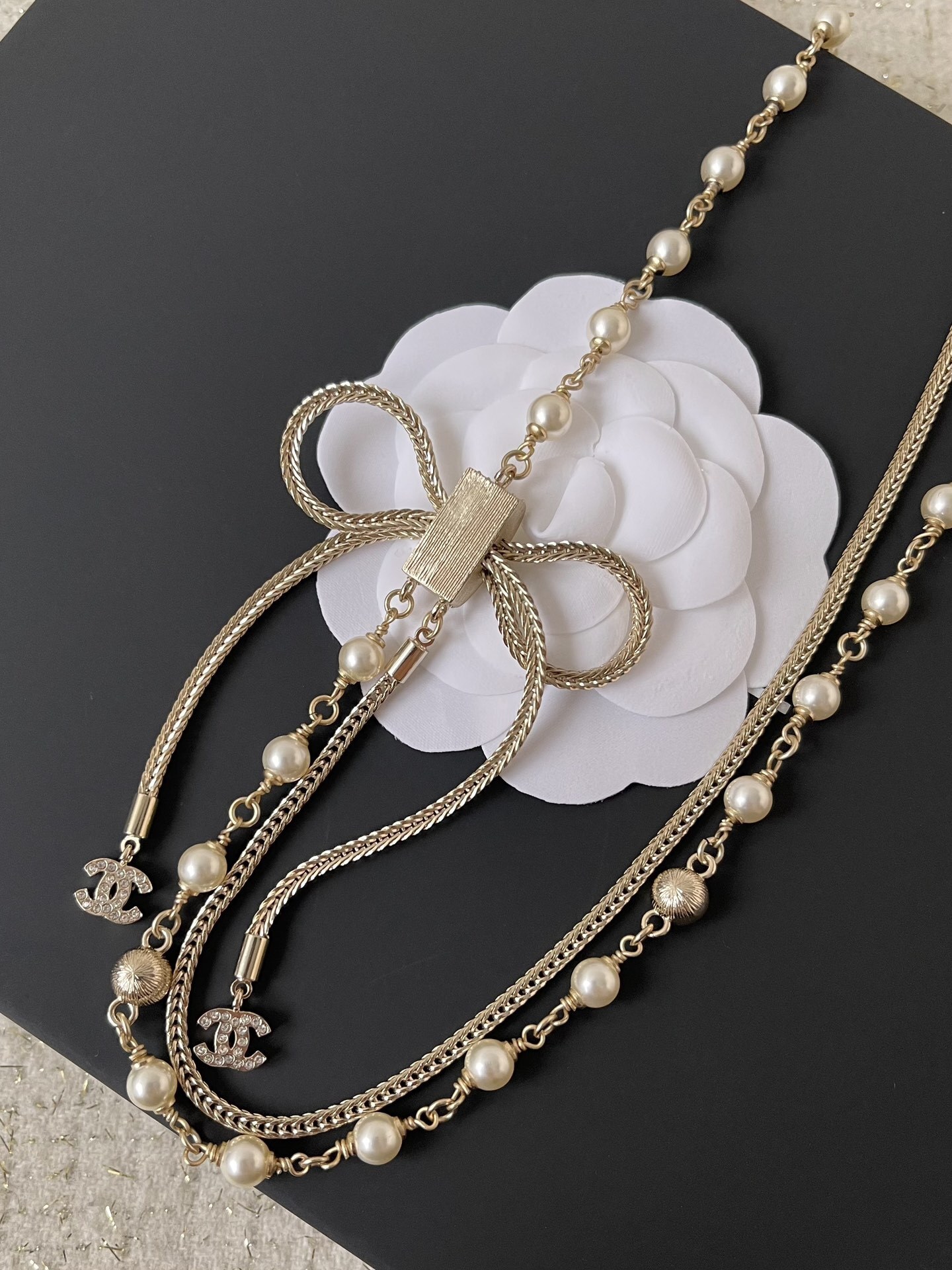 Elegant Double-Strand Pearl Necklace with Crystal Bow and CC Logo