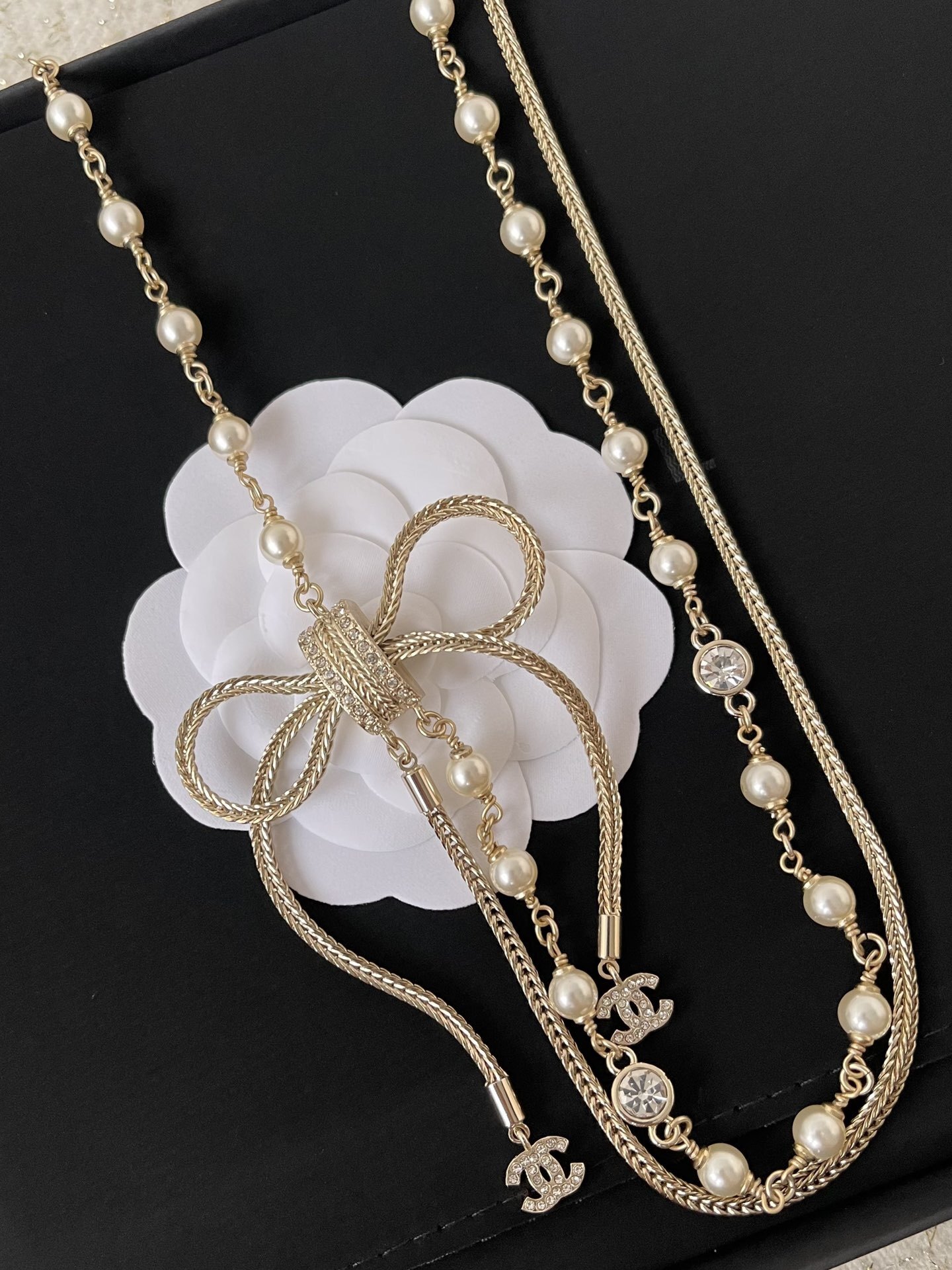 Elegant Double-Strand Pearl Necklace with Crystal Bow and CC Logo