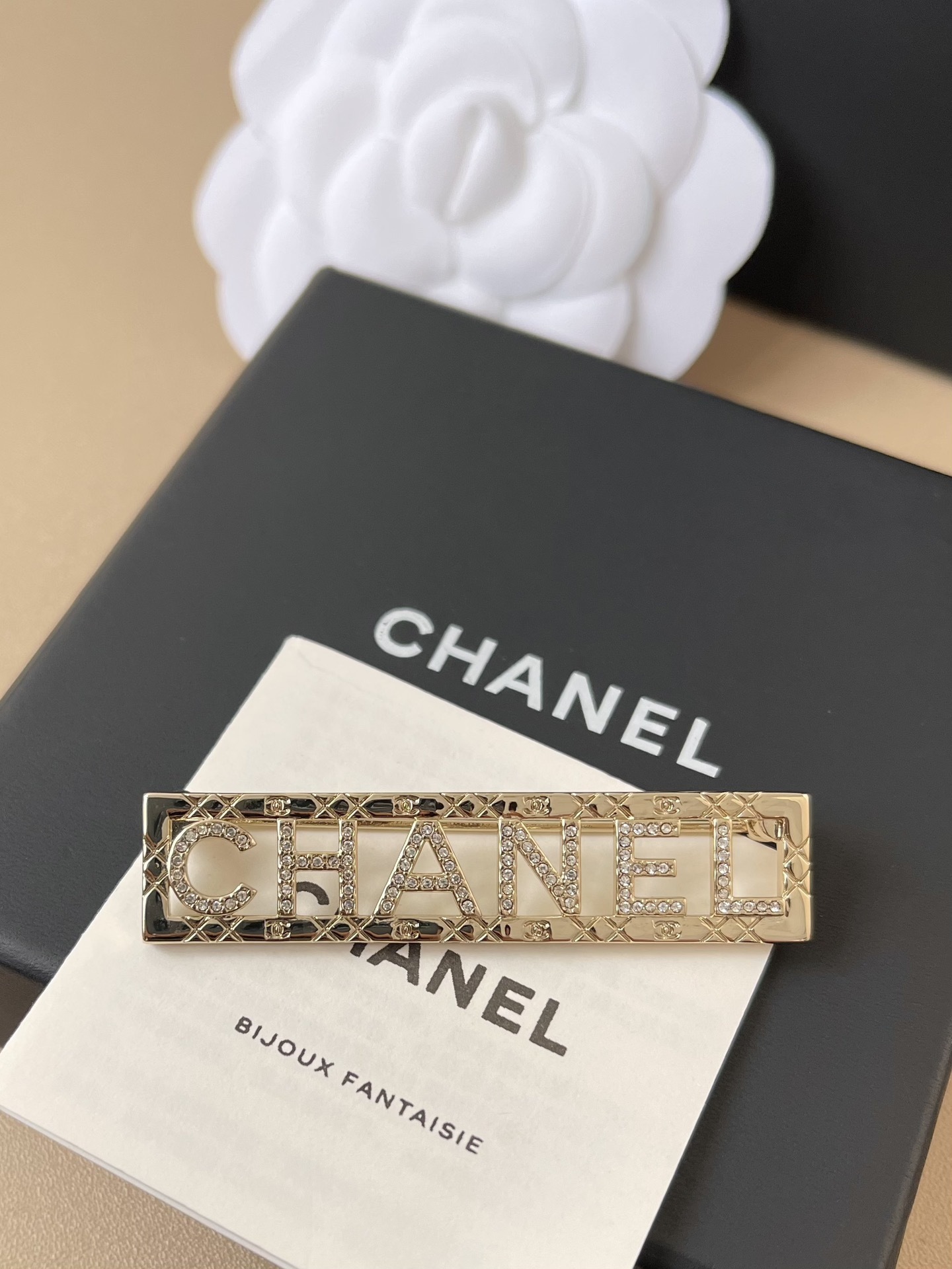 Chanel Gold-Tone Crystal Logo Brooch - Elegant Designer Jewelry