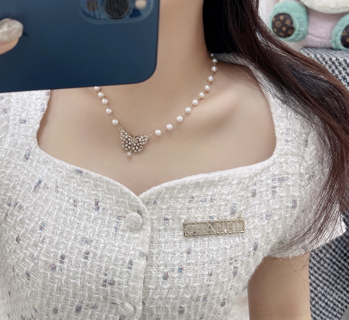 Chanel Gold-Tone Crystal Logo Brooch - Elegant Designer Jewelry