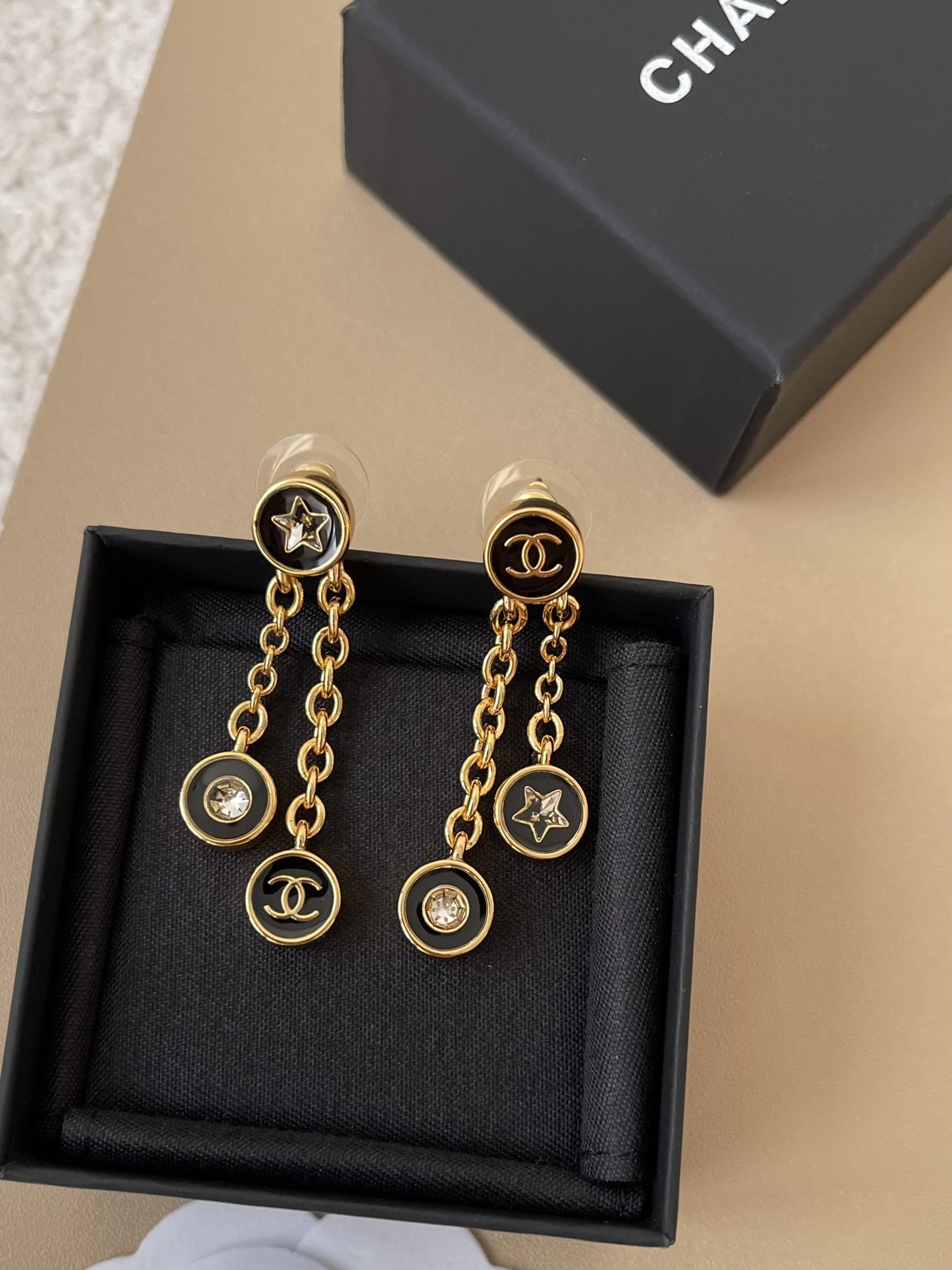 Elegant Gold-Tone Black Enamel CC Star Dangle Earrings