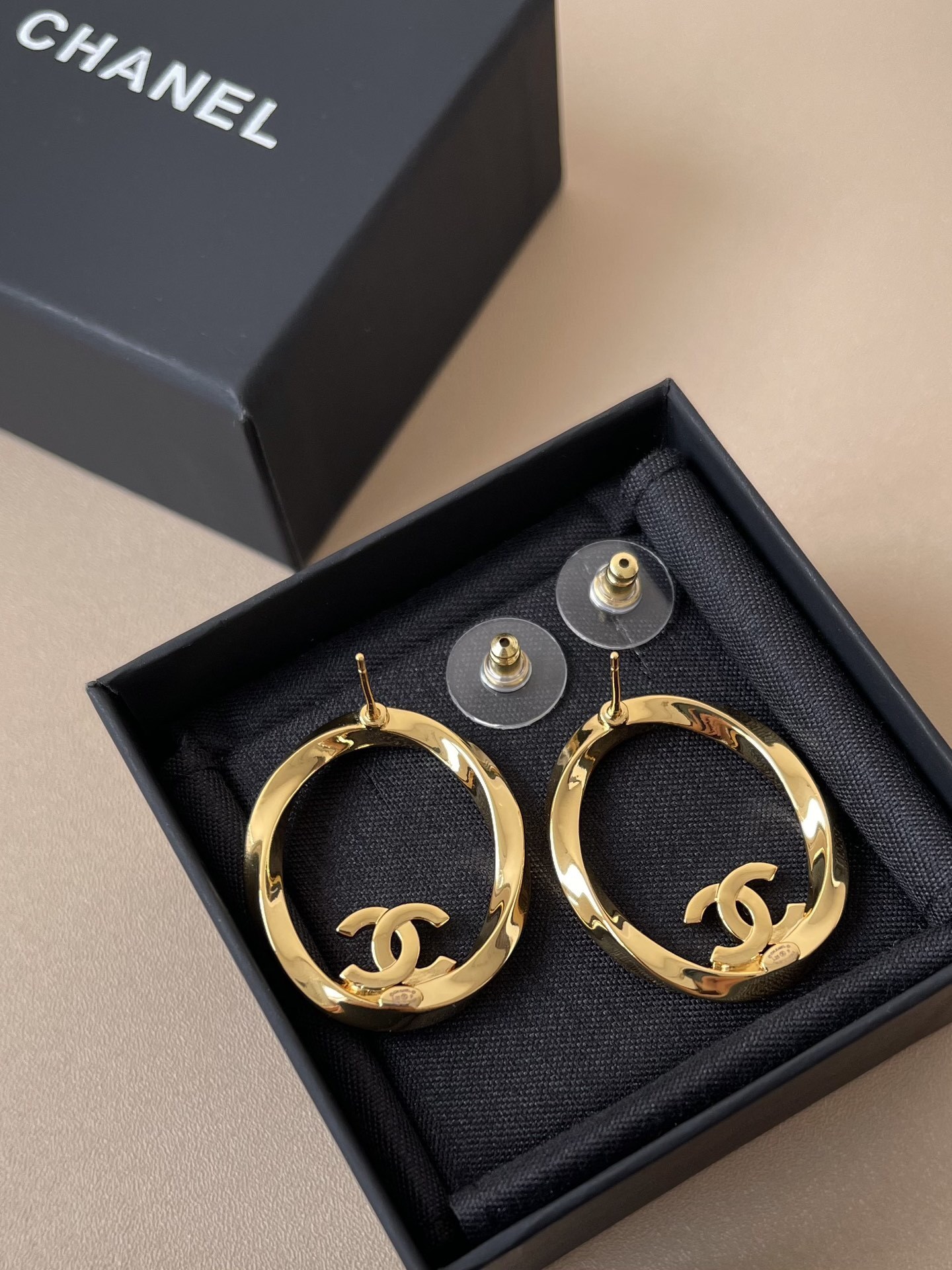 Luxury Gold-Tone Oval Hoop Earrings with Sparkling Crystal CC Logo