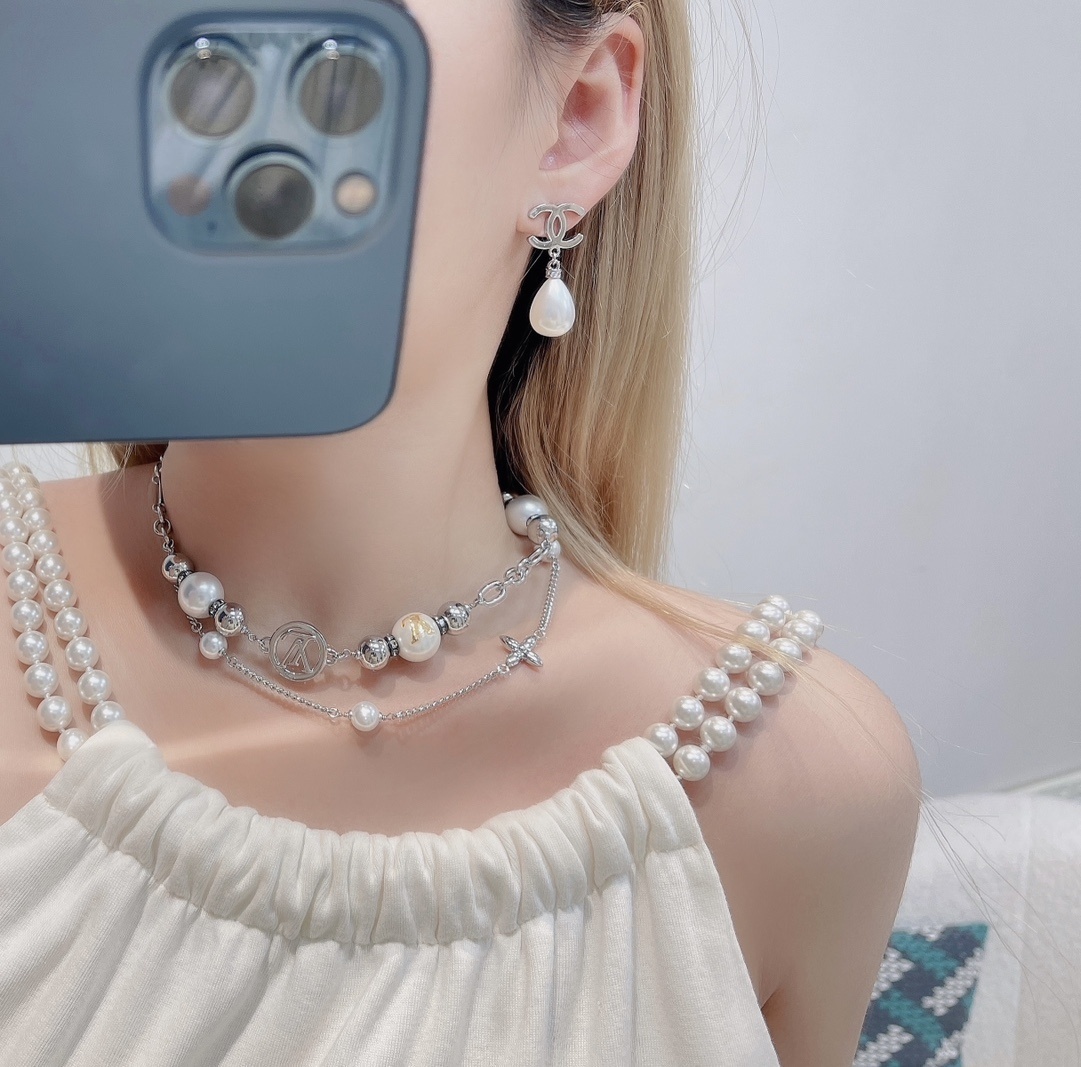 Chanel CC Logo Silver Teardrop Pearl Drop Earrings - Elegant Luxury