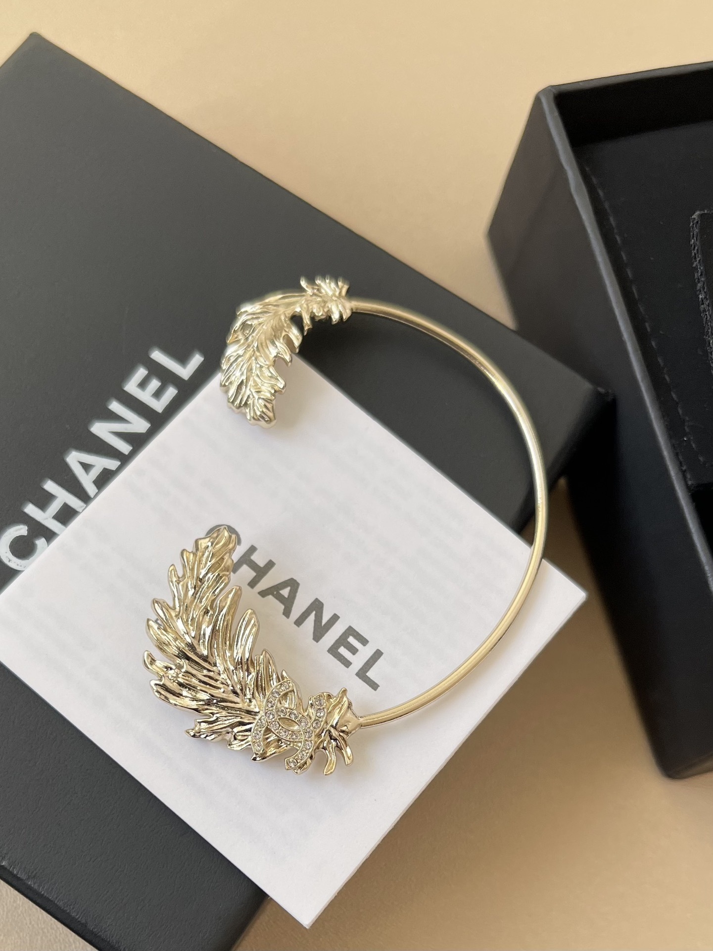 Chanel Crystal CC Feather Ear Cuff - Elegant Gold-Tone Earring