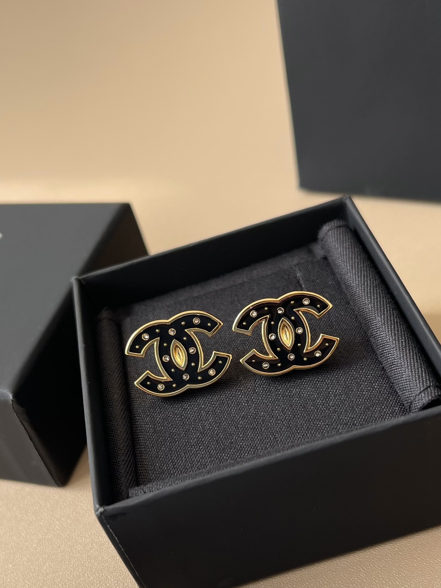 Elegant Black Enamel CC Logo Stud Earrings with Gold Trim