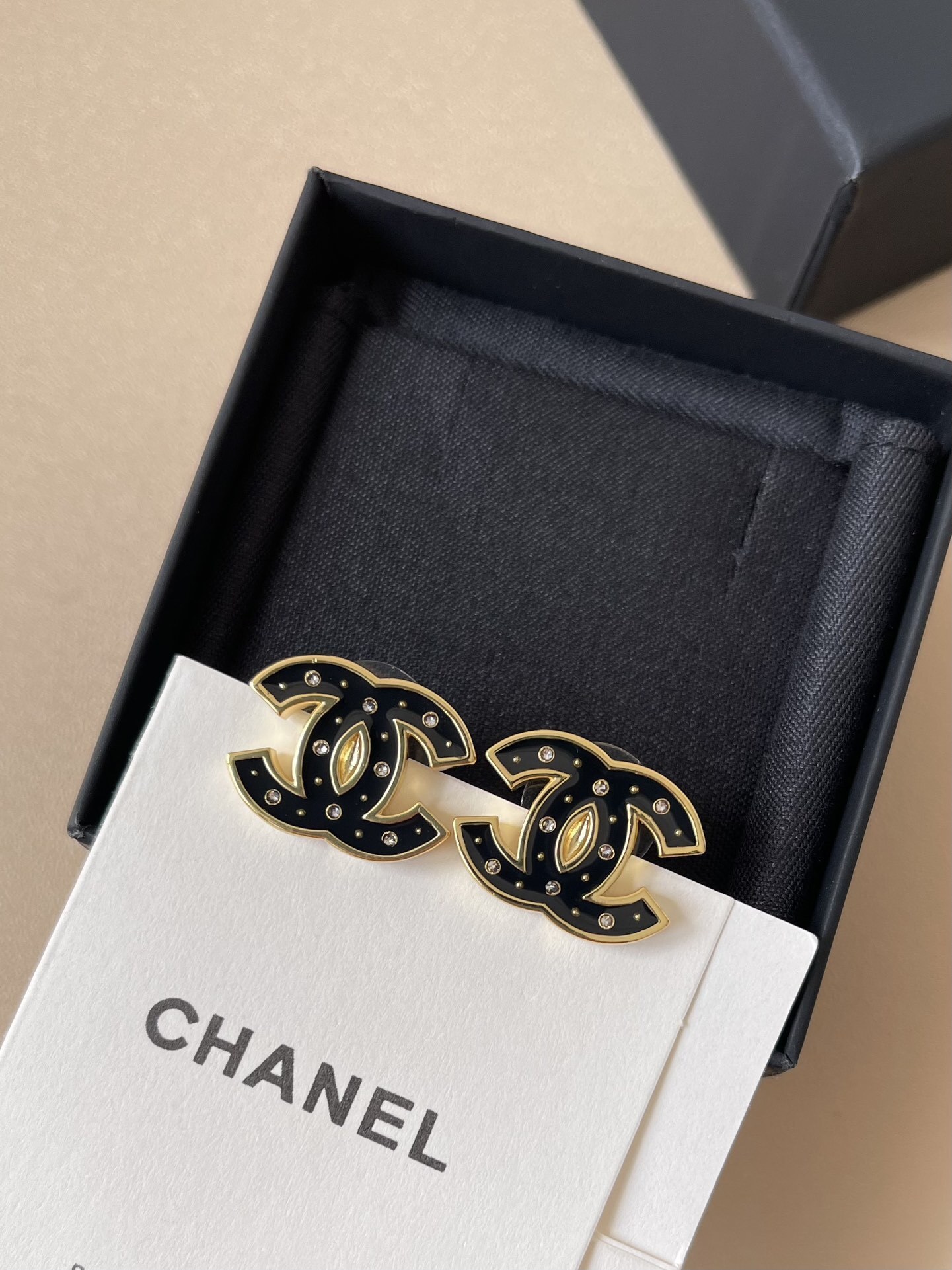 Elegant Black Enamel CC Logo Stud Earrings with Gold Trim