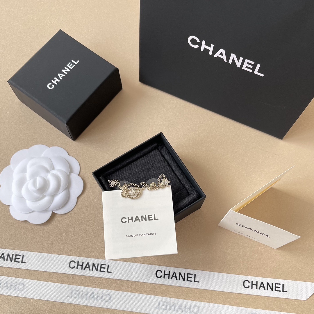 Chanel Gold-Tone Crystal Chain Script Earrings - Elegant Jewelry