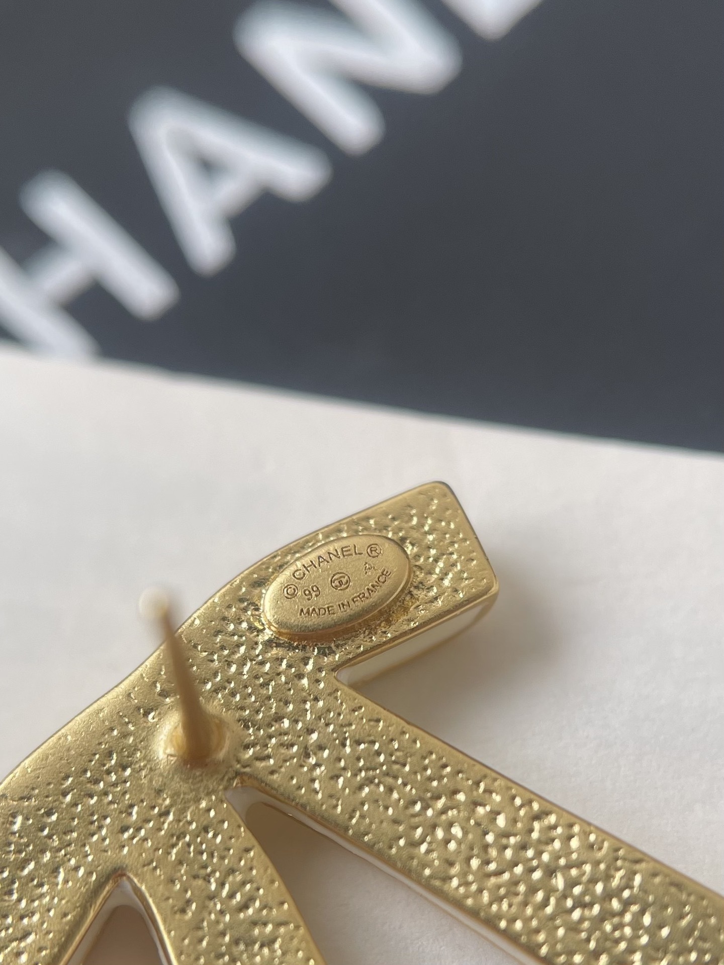 Chanel White Ribbon Bow Stud Earrings - Elegant Gold-Tone Jewelry