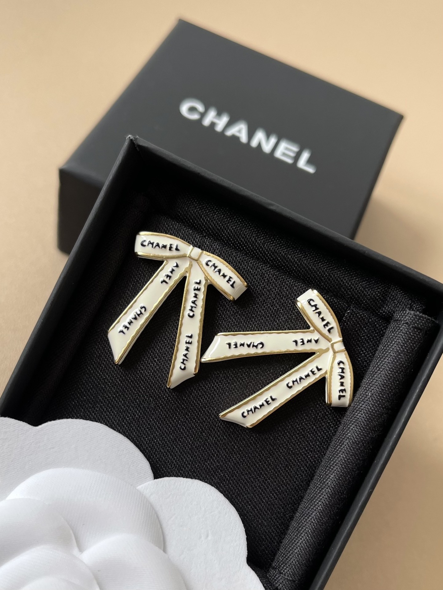 Chanel White Ribbon Bow Stud Earrings - Elegant Gold-Tone Jewelry