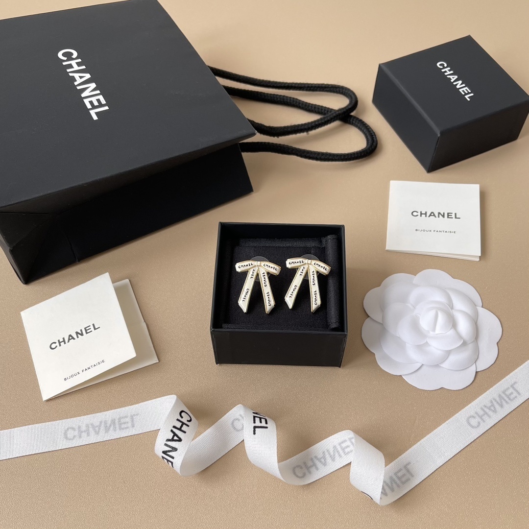 Chanel White Ribbon Bow Stud Earrings - Elegant Gold-Tone Jewelry
