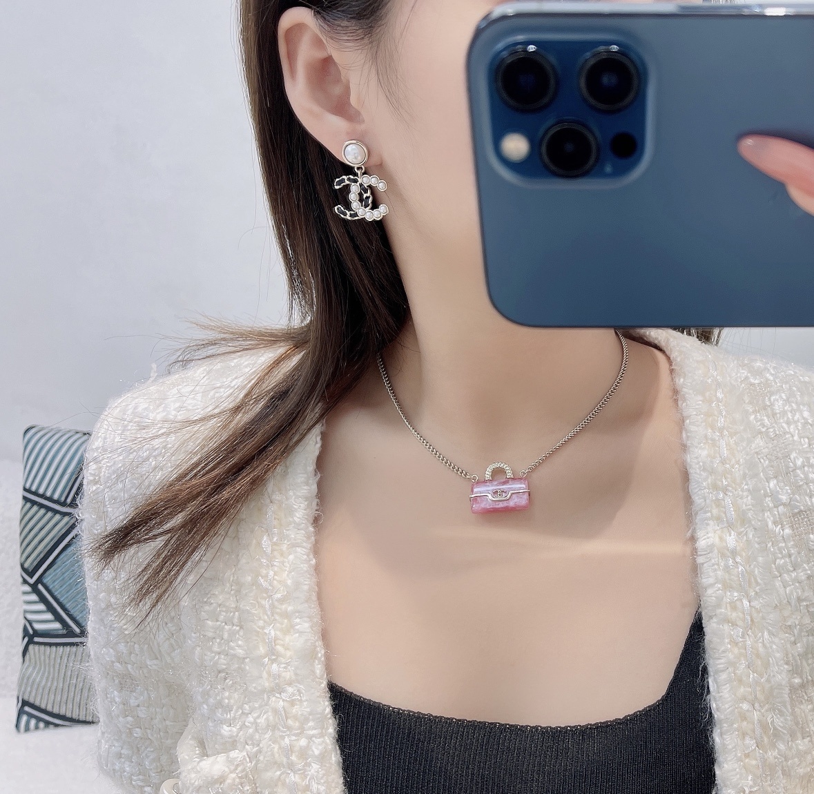 Elegant CC Logo Pearl Drop Earrings with Interwoven Black Leather