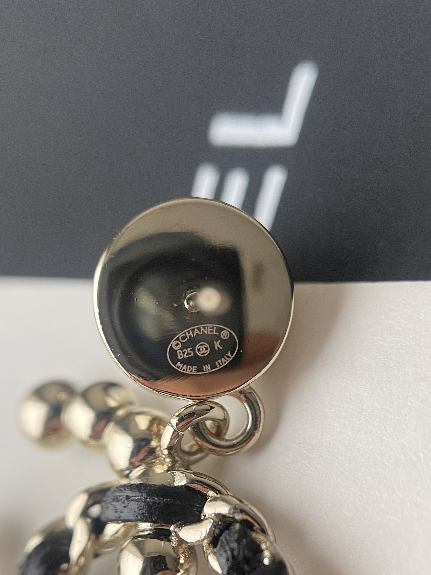 Elegant CC Logo Pearl Drop Earrings with Interwoven Black Leather