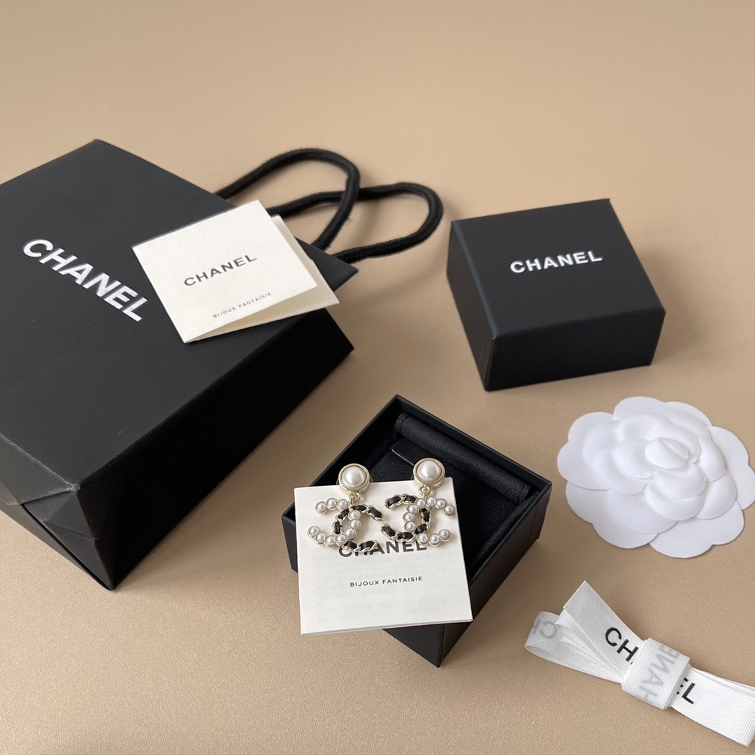 Elegant CC Logo Pearl Drop Earrings with Interwoven Black Leather