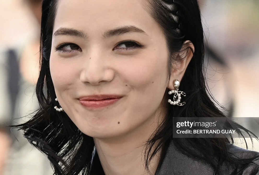 Elegant CC Logo Pearl Drop Earrings with Interwoven Black Leather