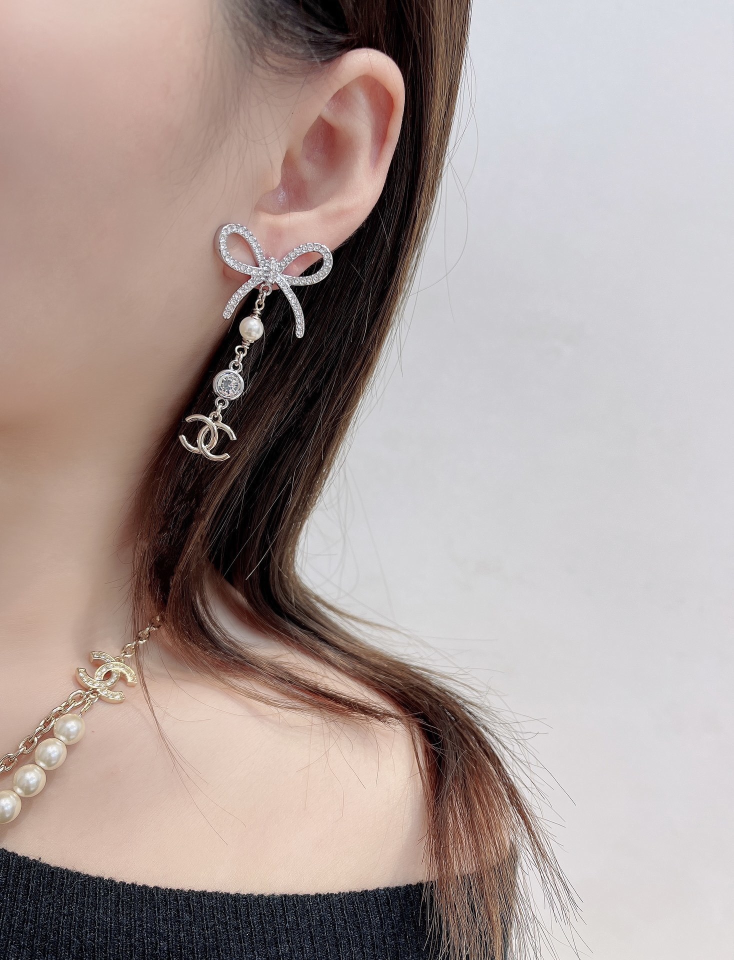 Luxury Chanel Silver Ribbon Bow Crystal Pearl CC Logo Drop Earrings