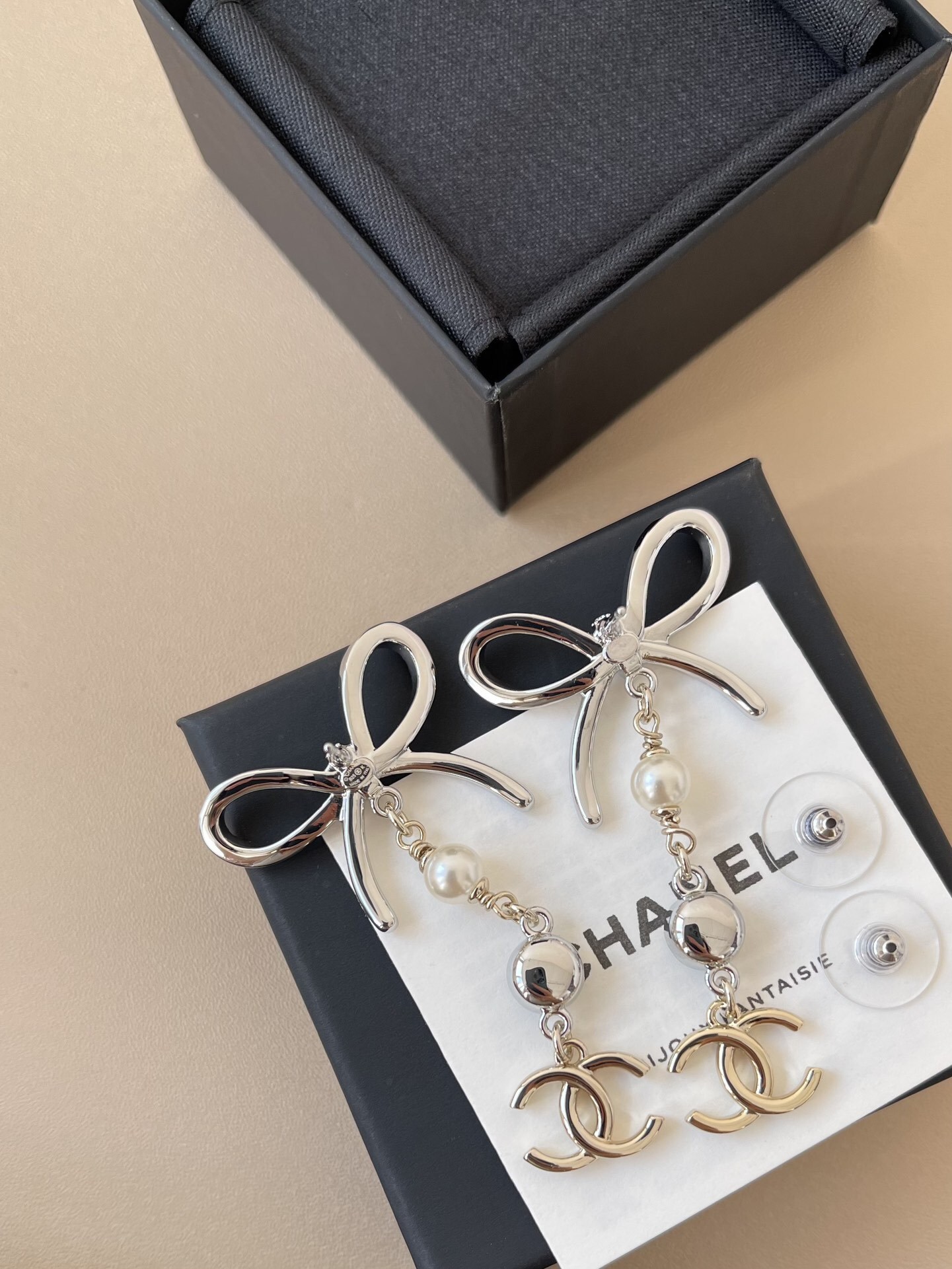 Luxury Chanel Silver Ribbon Bow Crystal Pearl CC Logo Drop Earrings