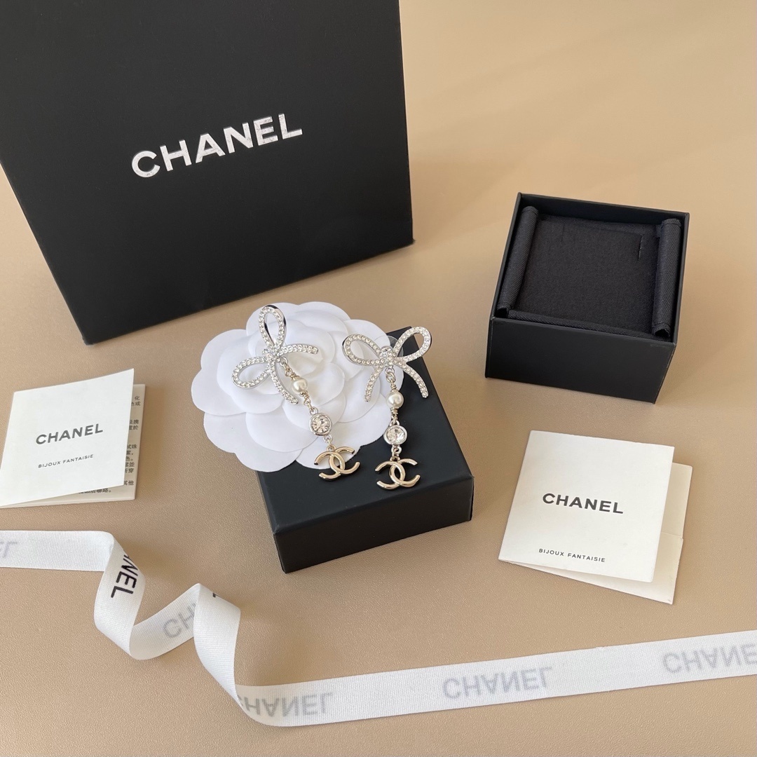 Luxury Chanel Silver Ribbon Bow Crystal Pearl CC Logo Drop Earrings