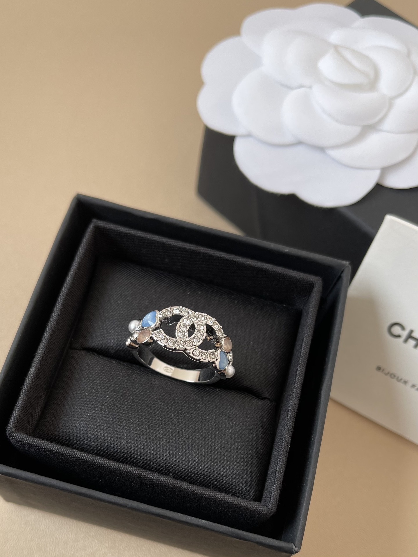 Elegant Interlocking CC Crystal Ring with Pearl & Blue Accents