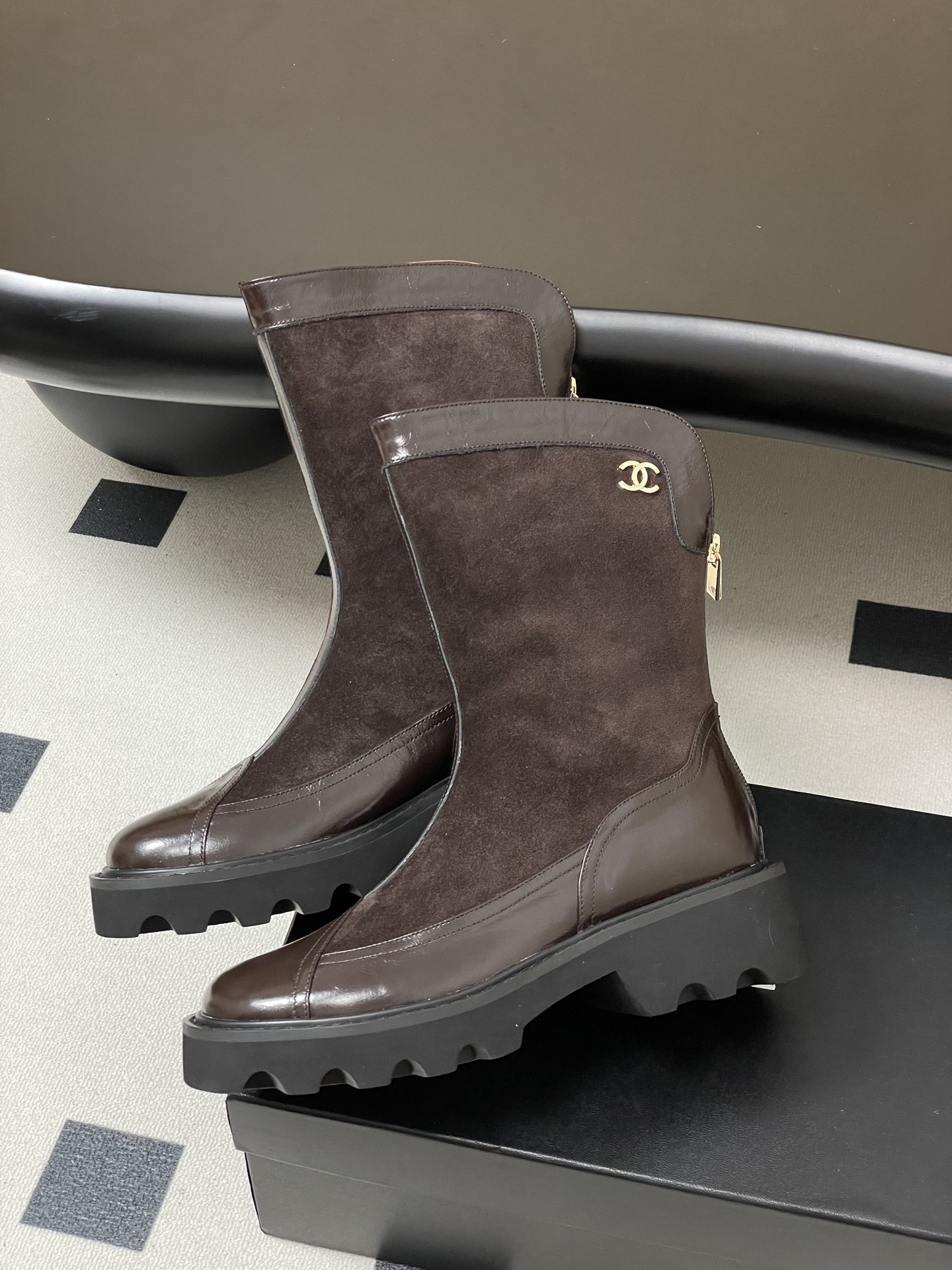 Pair of Chanel dark brown suede and leather mid-calf boots with chunky black lug soles and gold CC logo. - Hình 4