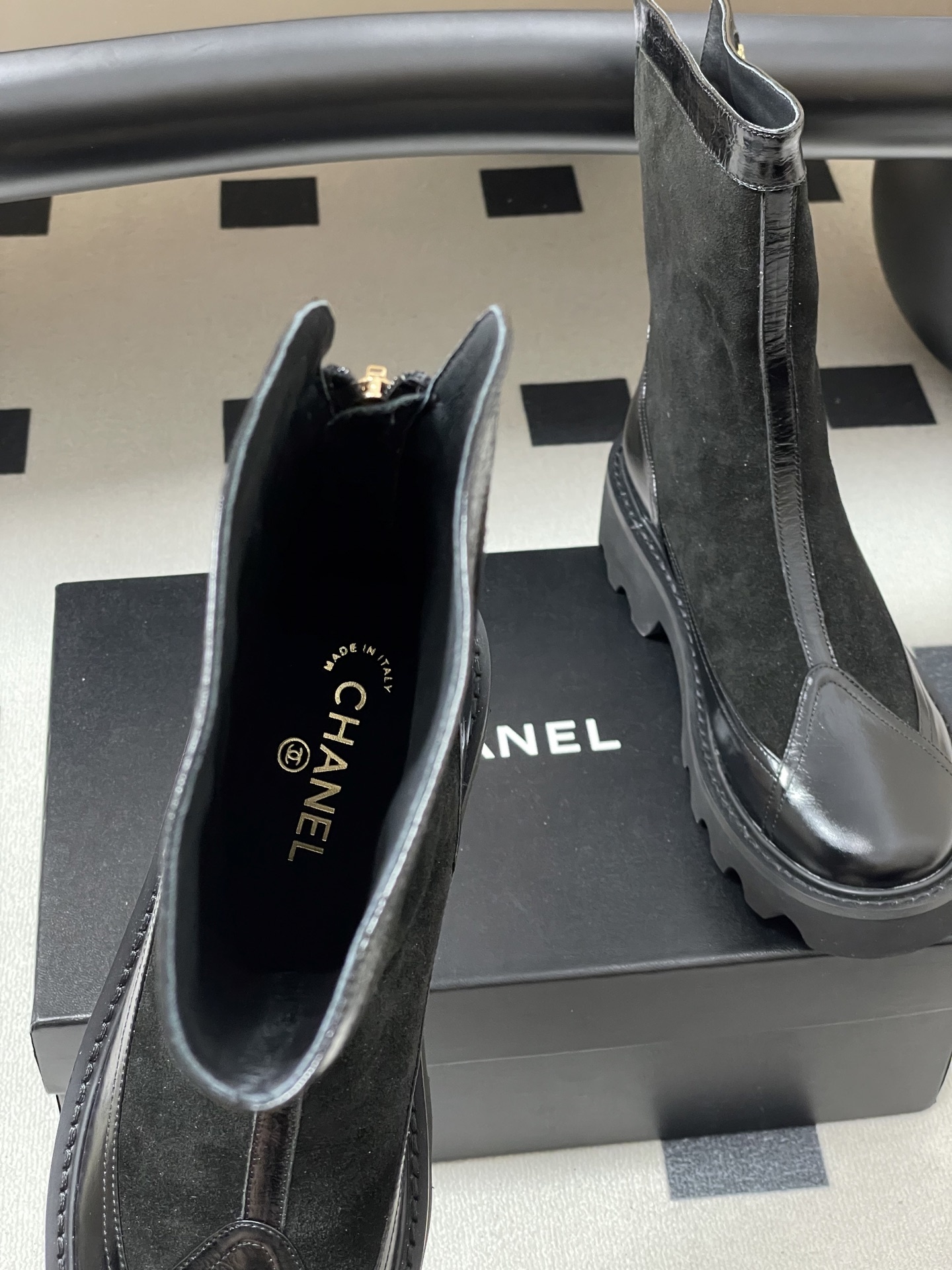 Pair of Chanel black suede and patent leather mid-calf boots with chunky lug soles and gold CC logo detail. - Hình 6