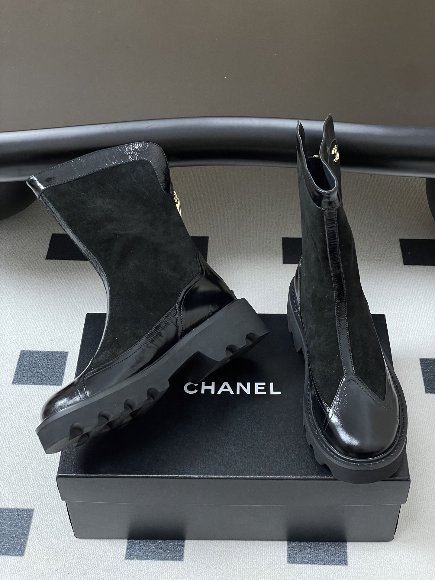 Pair of Chanel black suede and patent leather mid-calf boots with chunky lug soles and gold CC logo detail. - Hình 5
