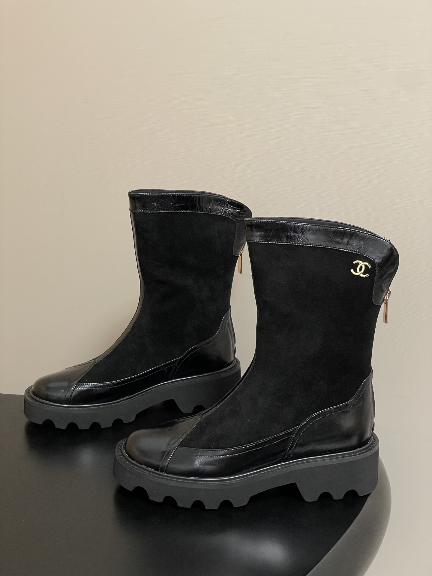 Pair of Chanel black suede and patent leather mid-calf boots with chunky lug soles and gold CC logo detail. - Hình 3