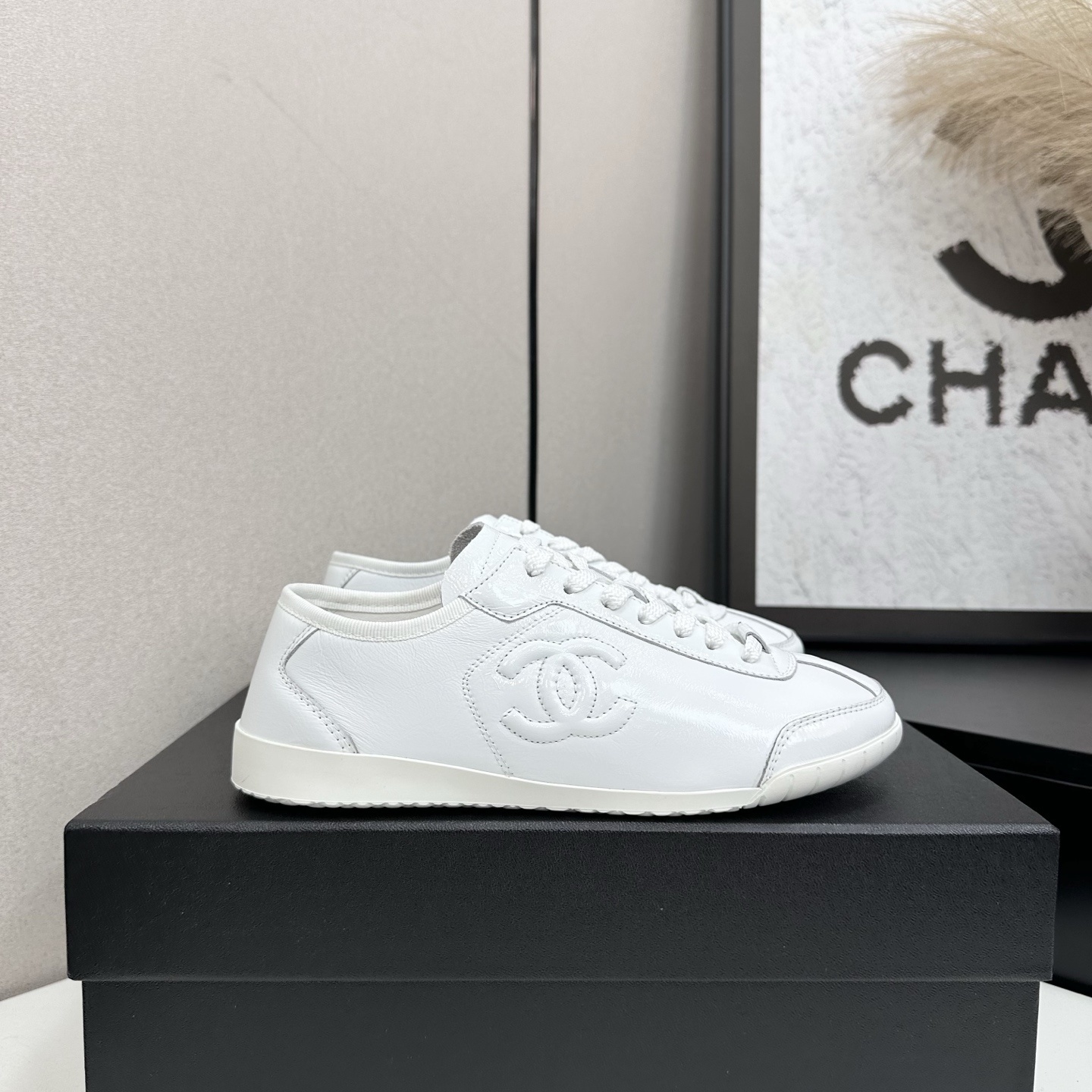 Chanel White Leather Sneakers with Embossed CC Logo – Women’s Luxury