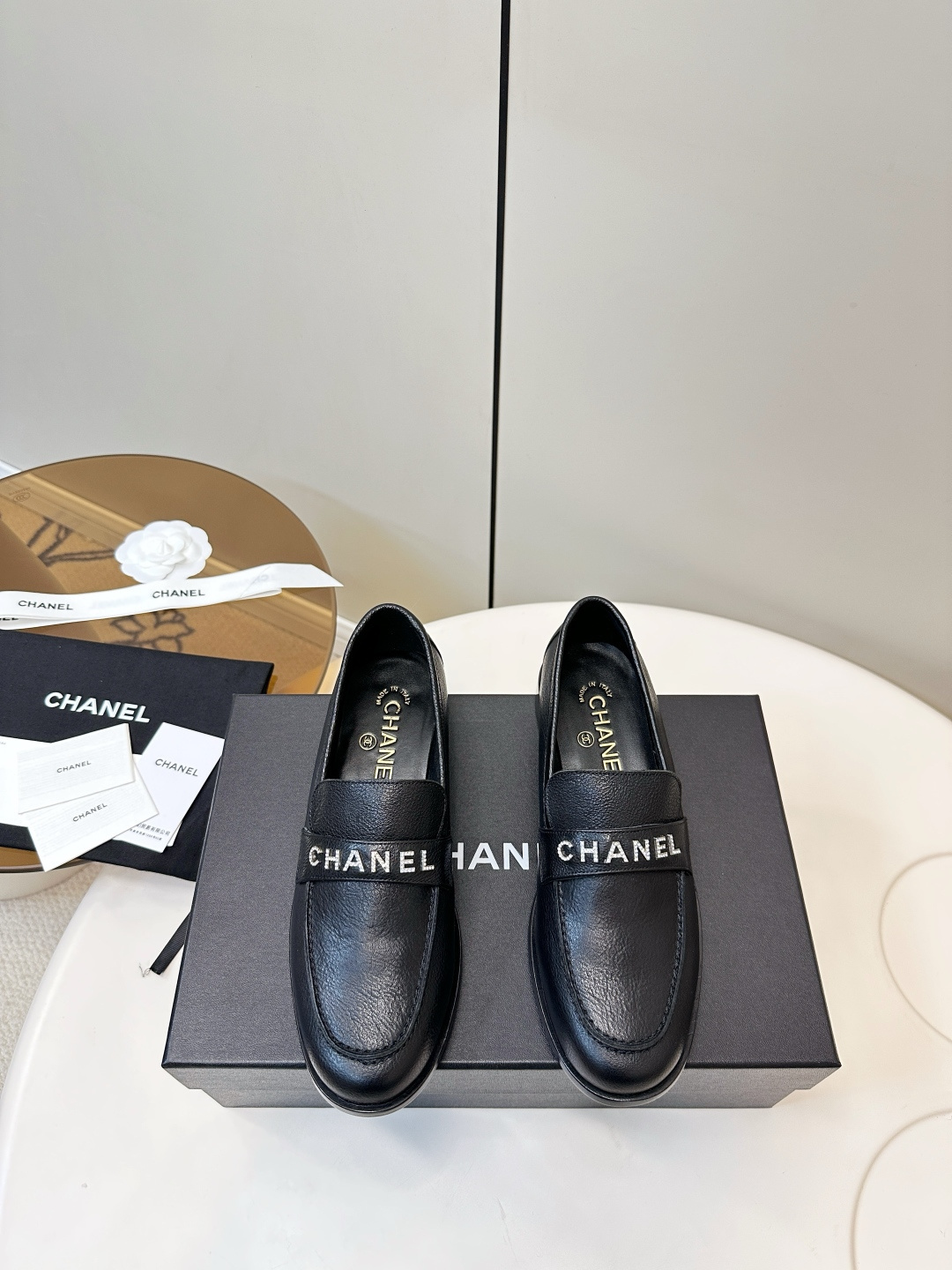 Chanel Black Leather Loafers with Crystal Logo – Women’s Flats