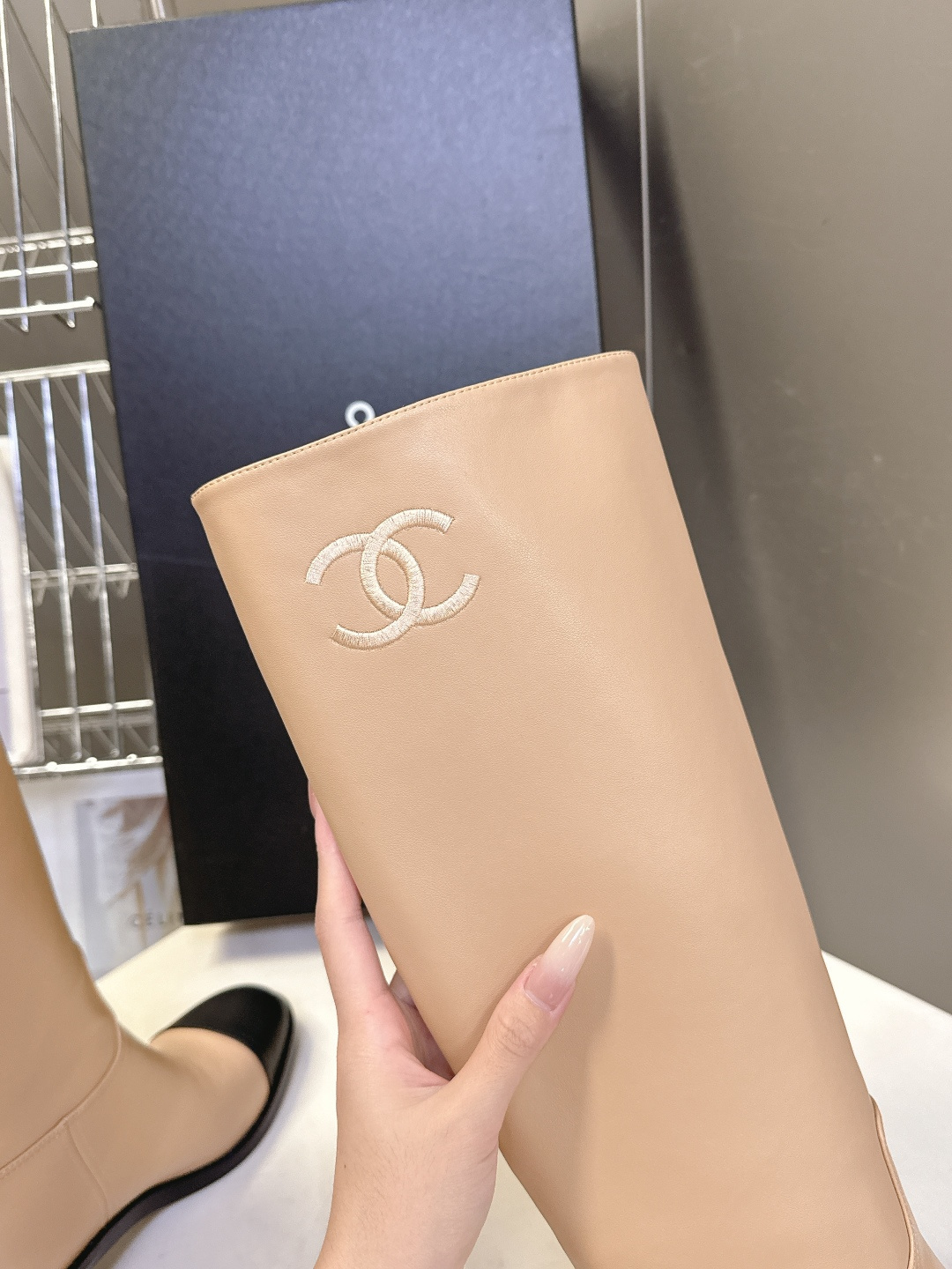 Chanel beige leather knee-high boots with black cap toe and embroidered CC logo on the side - Hình 8