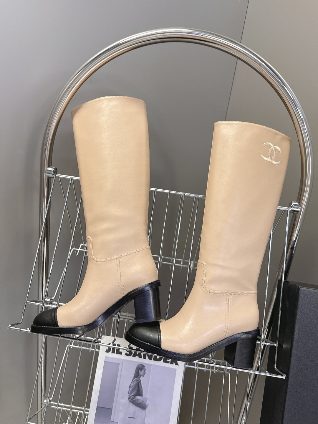 Chanel beige leather knee-high boots with black cap toe and embroidered CC logo on the side - Hình 6