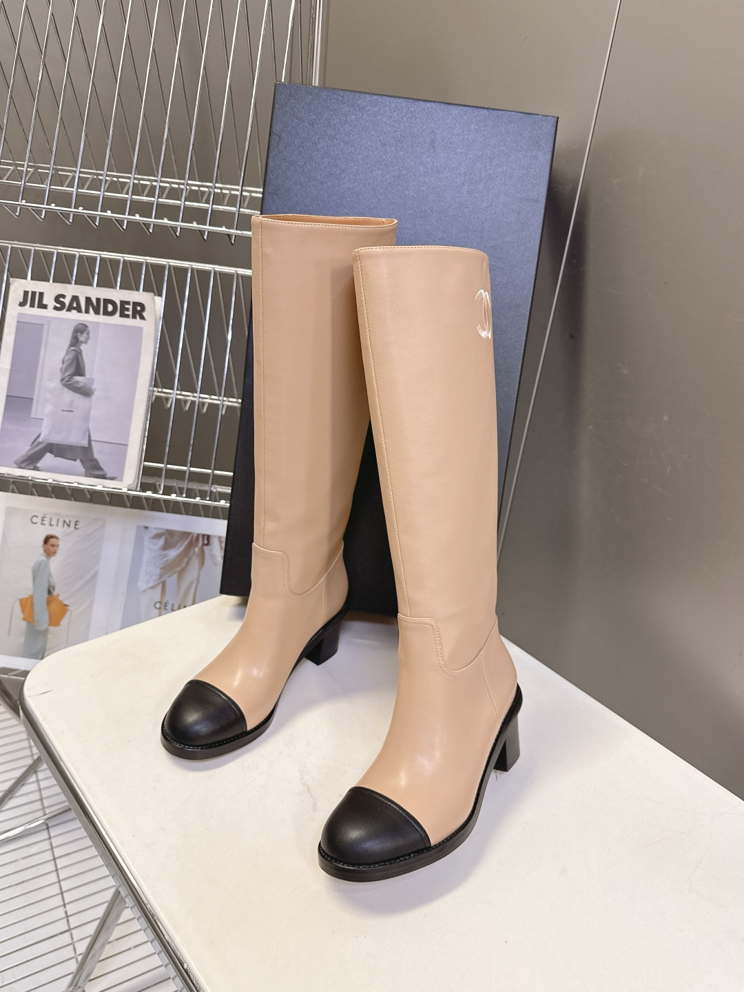 Chanel beige leather knee-high boots with black cap toe and embroidered CC logo on the side - Hình 4