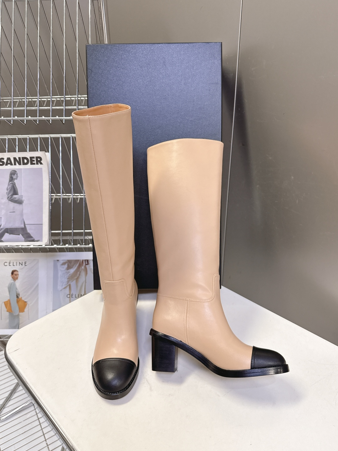Chanel beige leather knee-high boots with black cap toe and embroidered CC logo on the side - Hình 3