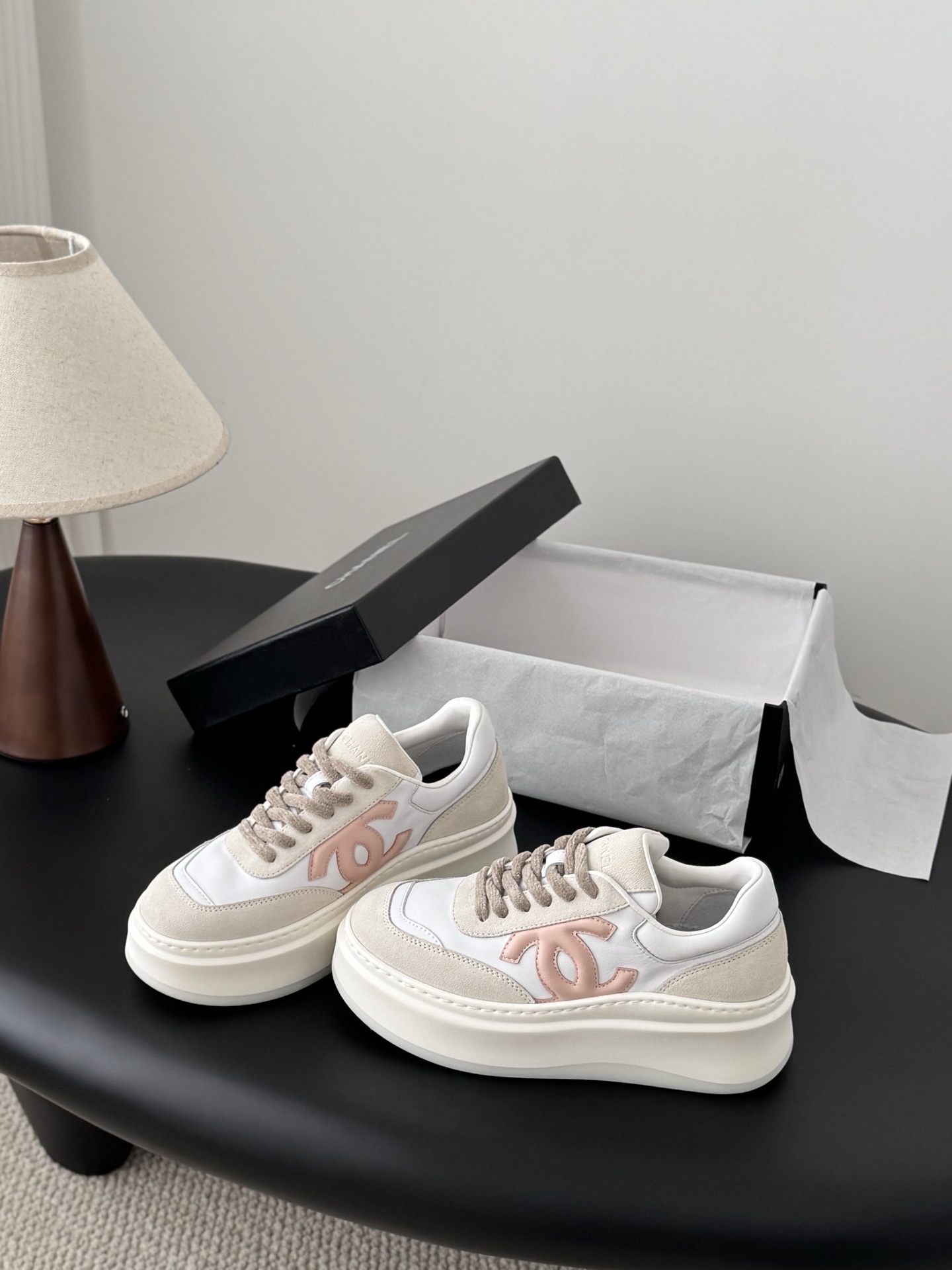 A pair of Chanel white and cream leather platform sneakers with pink interlocking C logo and original black box. - Hình 2