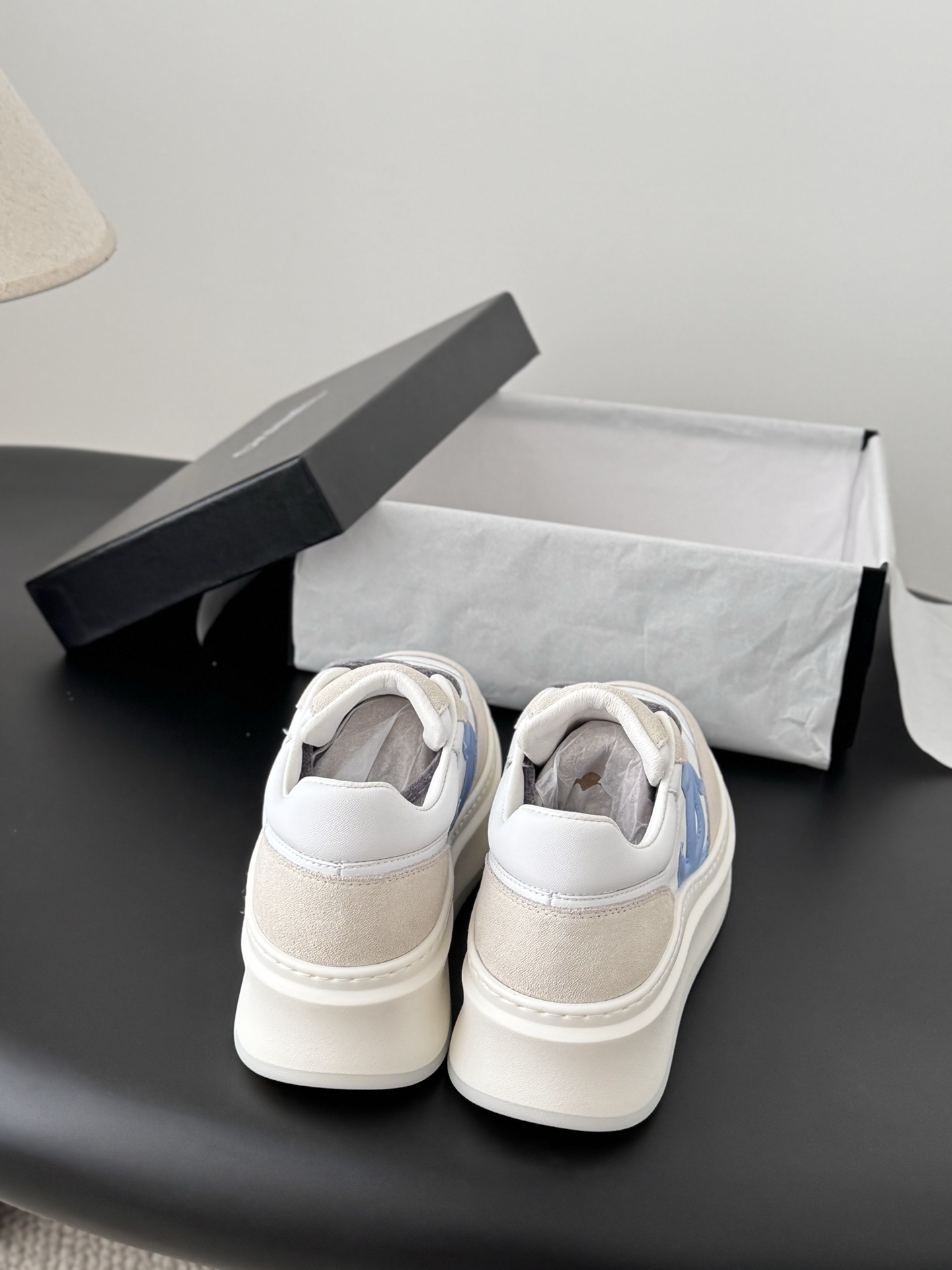 Pair of Chanel white and light blue platform sneakers with a black designer box - Hình 7