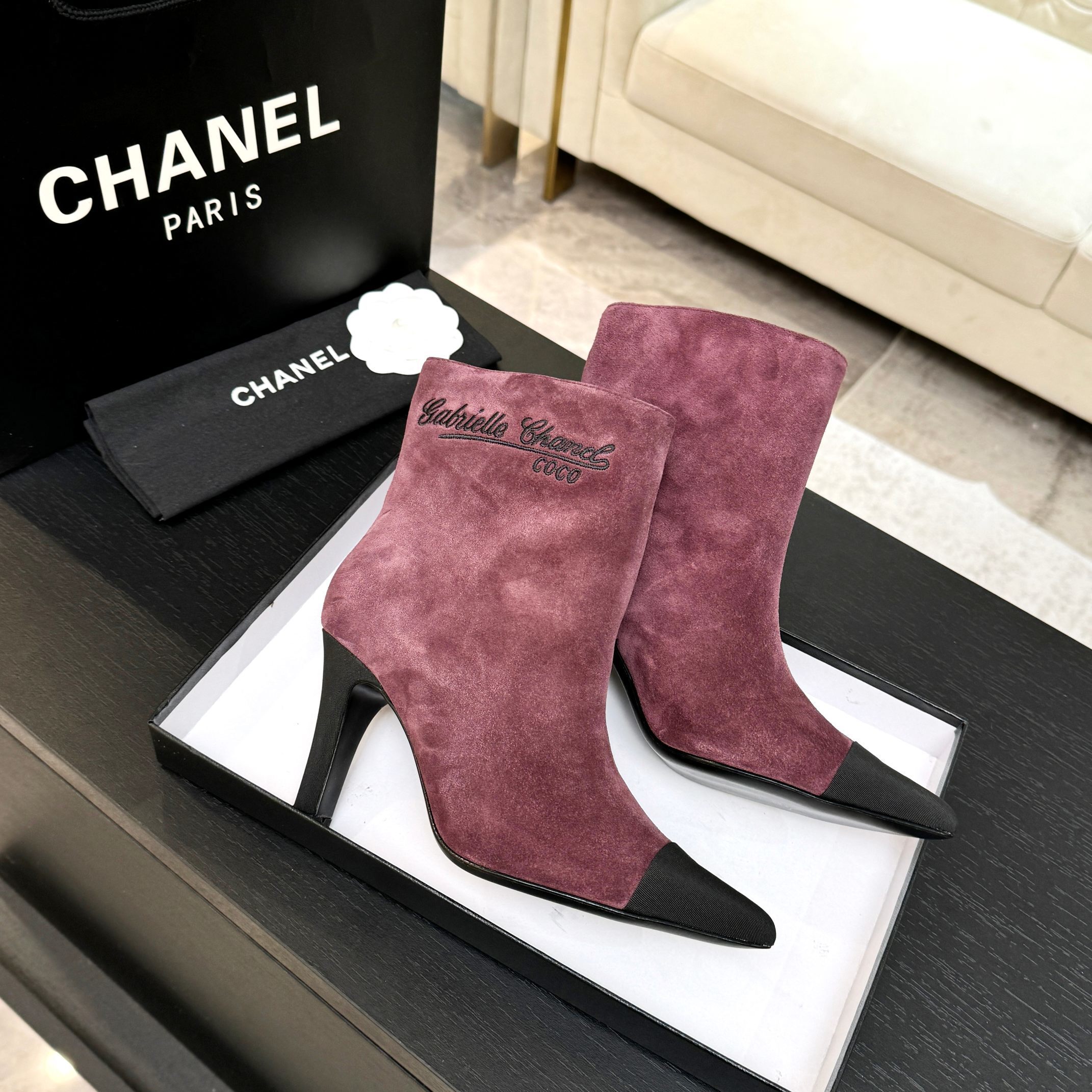 Burgundy Chanel suede ankle boots with black pointed cap toes and Gabrielle Chanel COCO embroidery on the side. - Hình 9