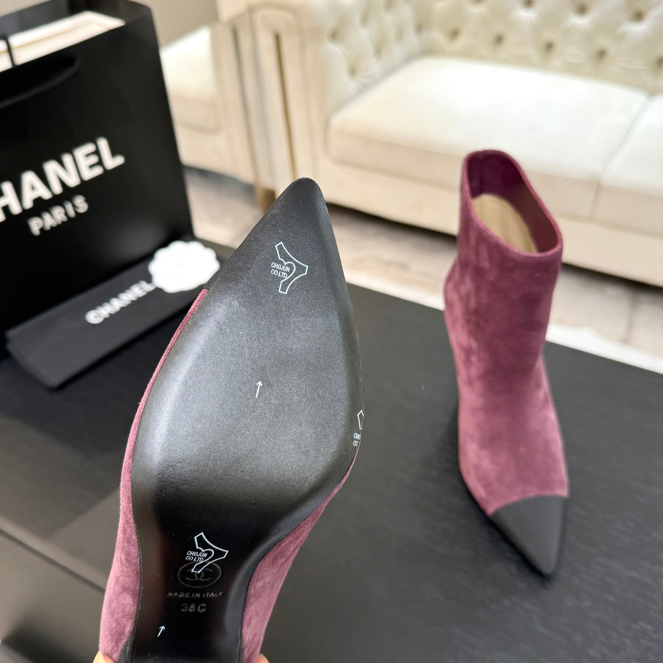 Burgundy Chanel suede ankle boots with black pointed cap toes and Gabrielle Chanel COCO embroidery on the side. - Hình 7