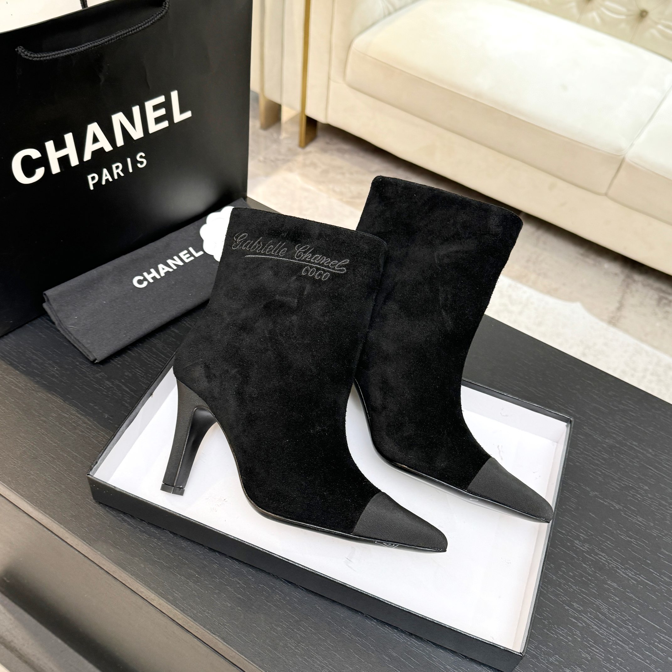 Pair of luxury Chanel Gabrielle black suede ankle boots with pointed grey cap-toe and COCO embroidery detail. - Hình 9