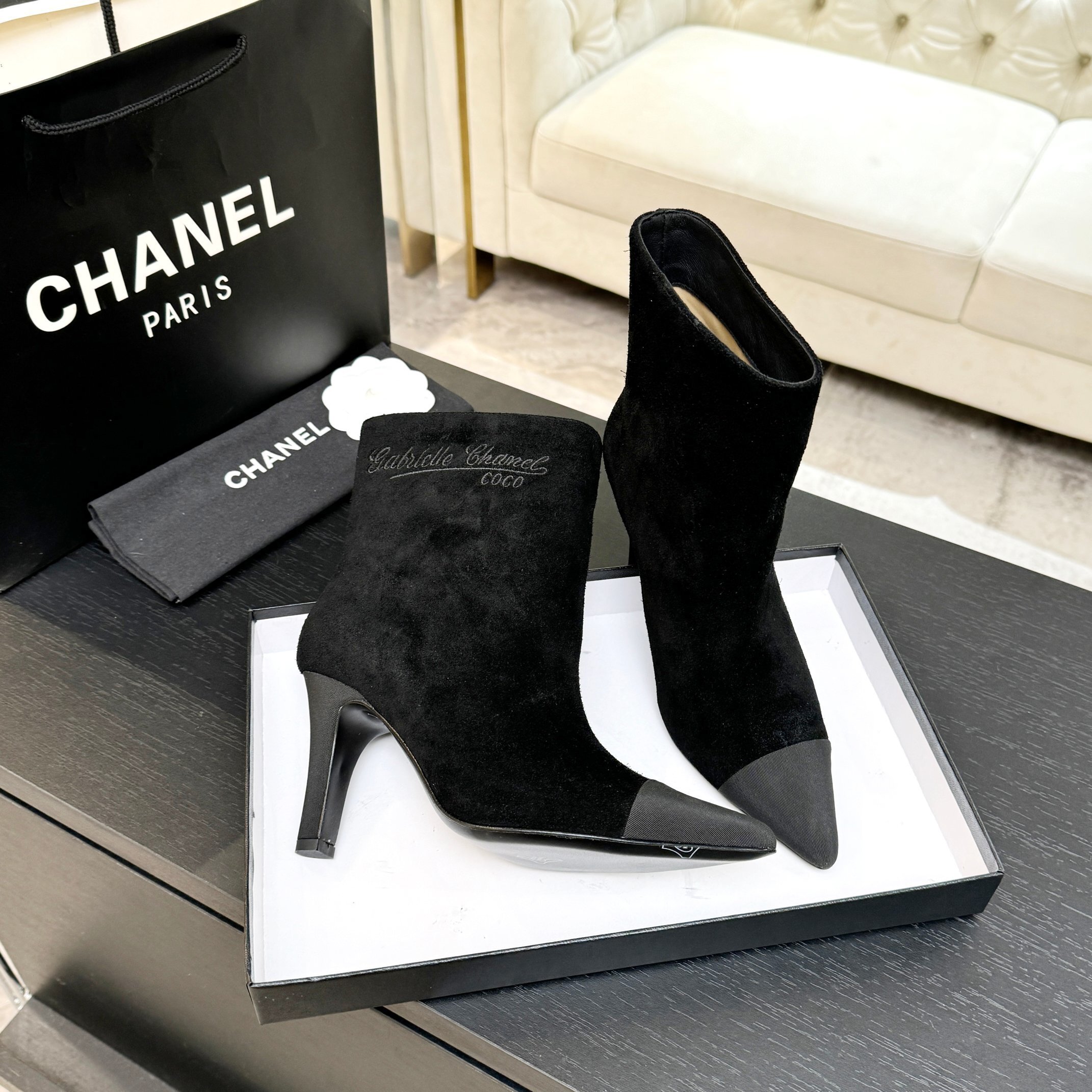Pair of luxury Chanel Gabrielle black suede ankle boots with pointed grey cap-toe and COCO embroidery detail. - Hình 7