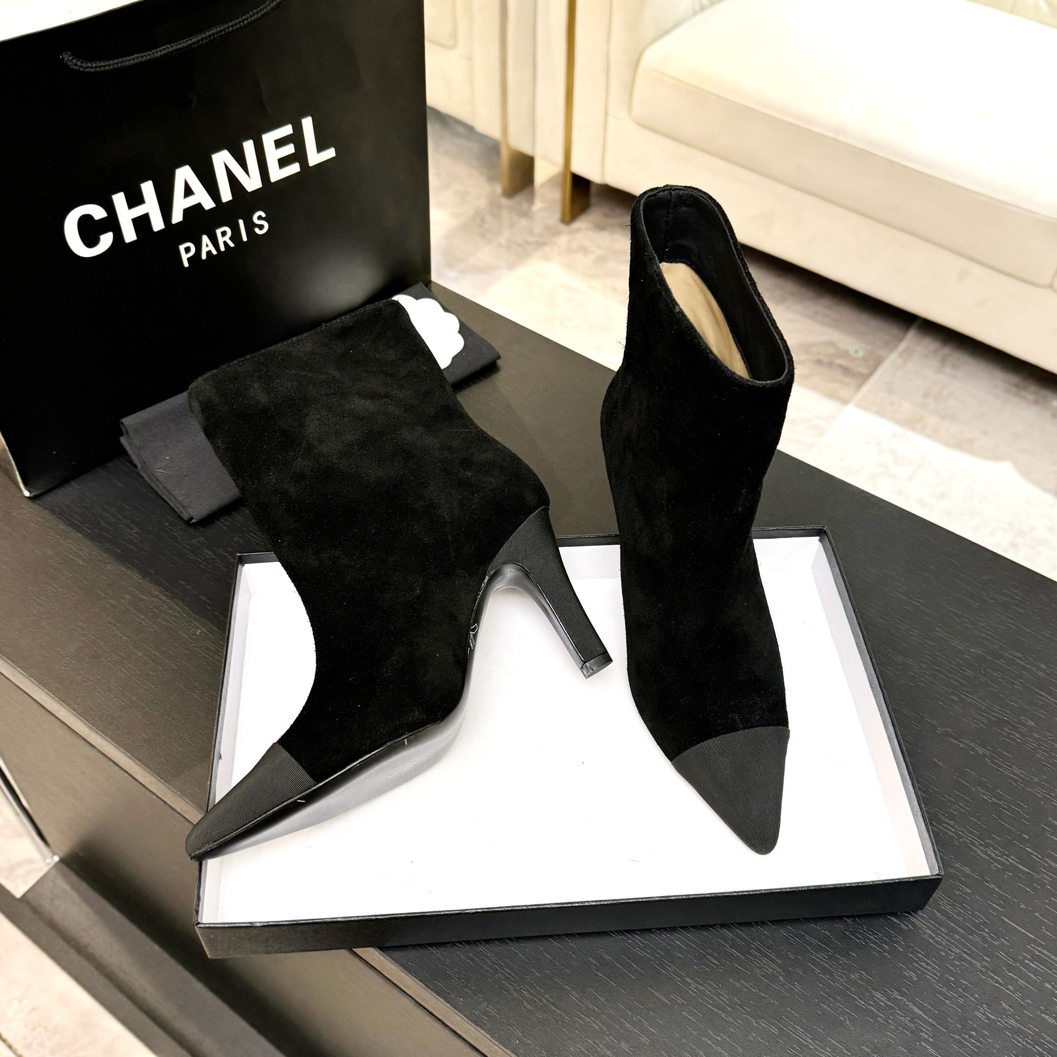 Pair of luxury Chanel Gabrielle black suede ankle boots with pointed grey cap-toe and COCO embroidery detail. - Hình 4