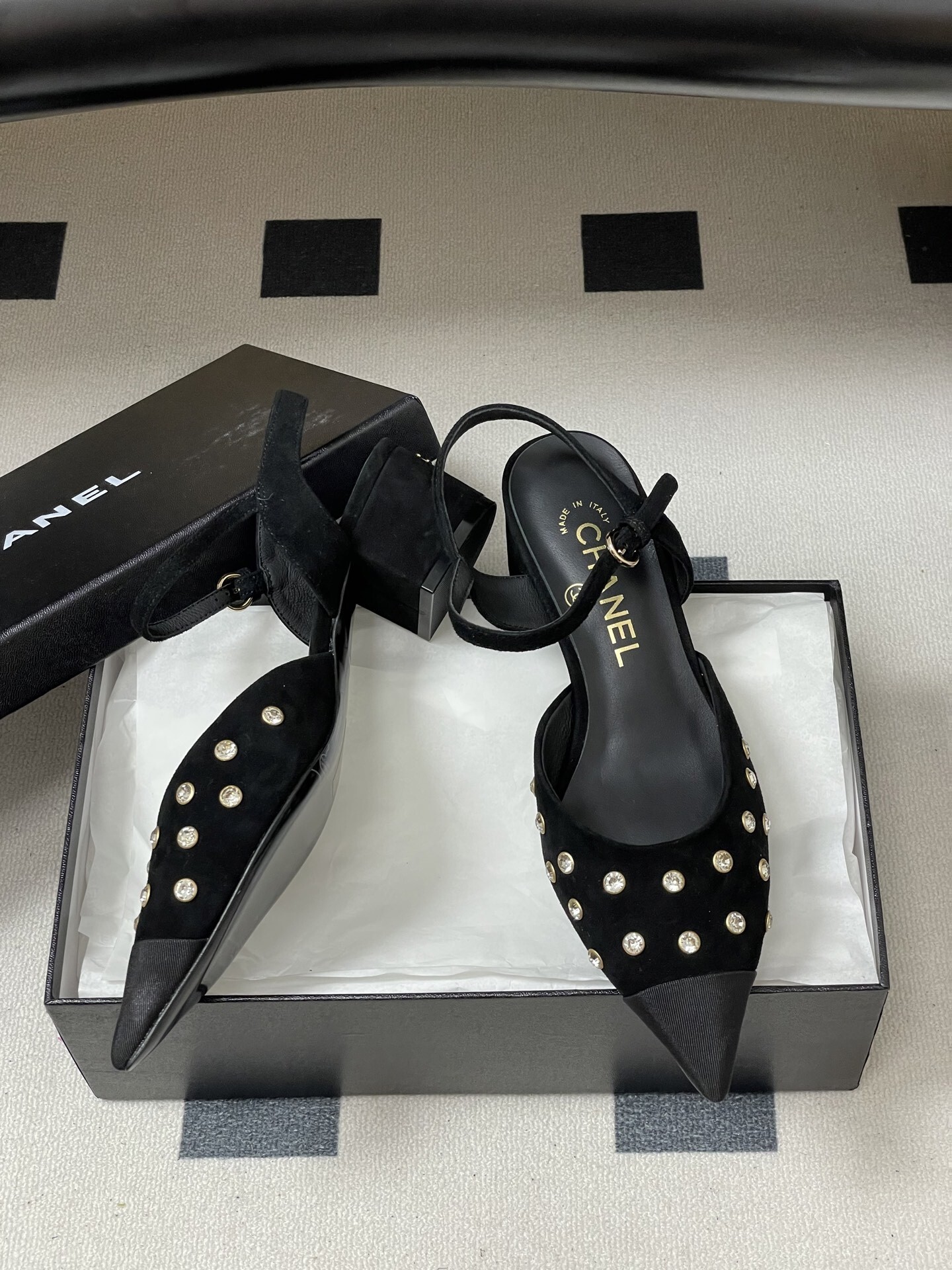 Chanel black suede slingback pumps with crystal embellishments and low block heels displayed on a black surface - Hình 6