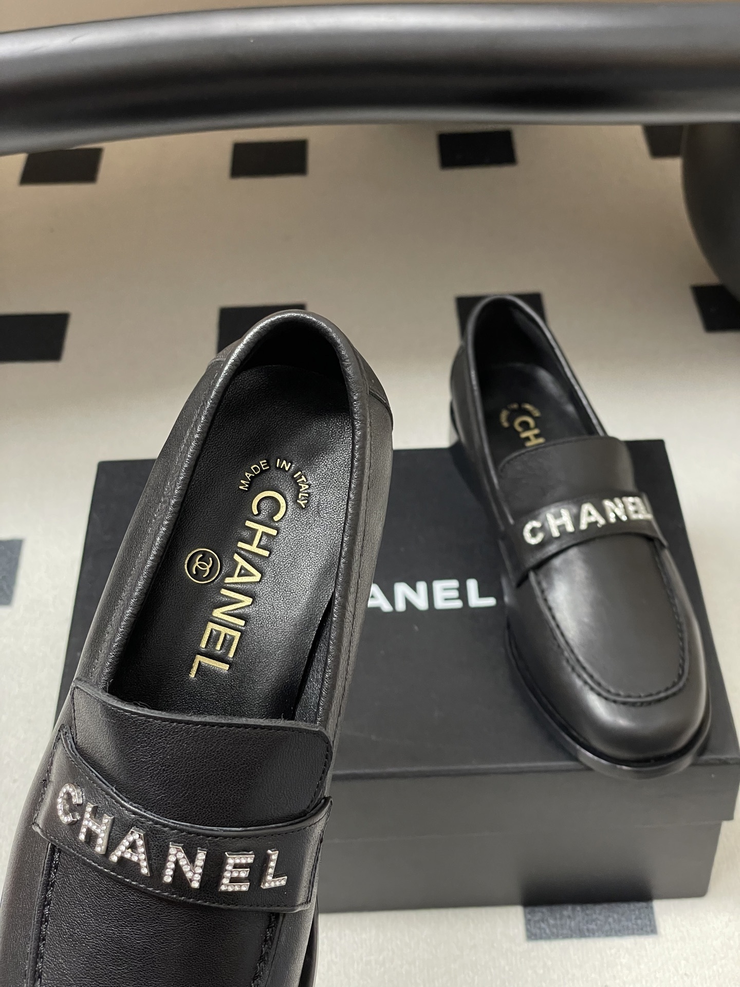 Pair of black leather Chanel loafers with crystal-embellished logo on the strap - Hình 7