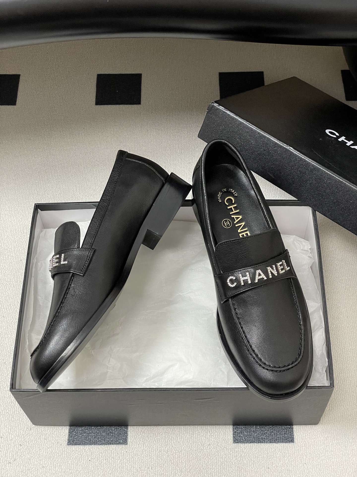 Pair of black leather Chanel loafers with crystal-embellished logo on the strap - Hình 6