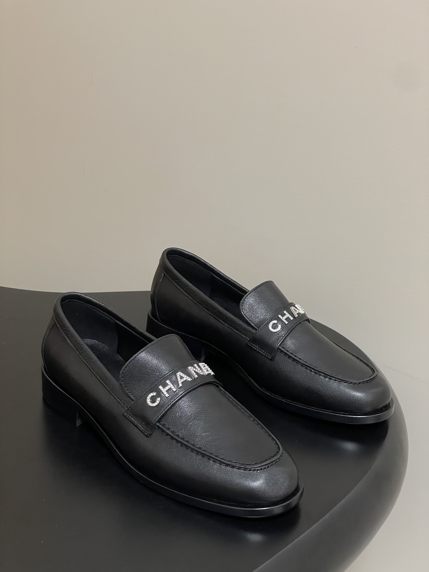 Chanel Black Leather Loafers with Crystal Logo Embellishment