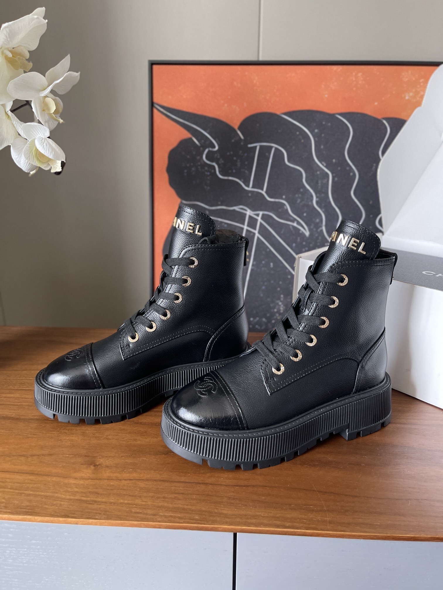 Chanel Black Grained Leather Platform Combat Boots with Gold Logo