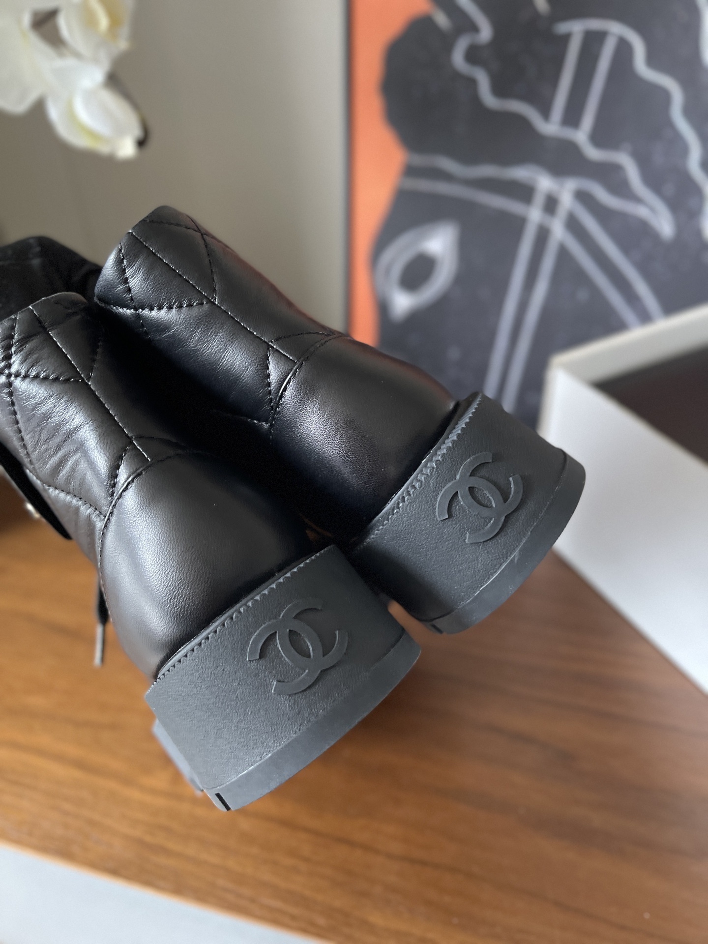 Chanel black quilted leather combat boots with gold CC logo and chunky lug sole - Hình 9