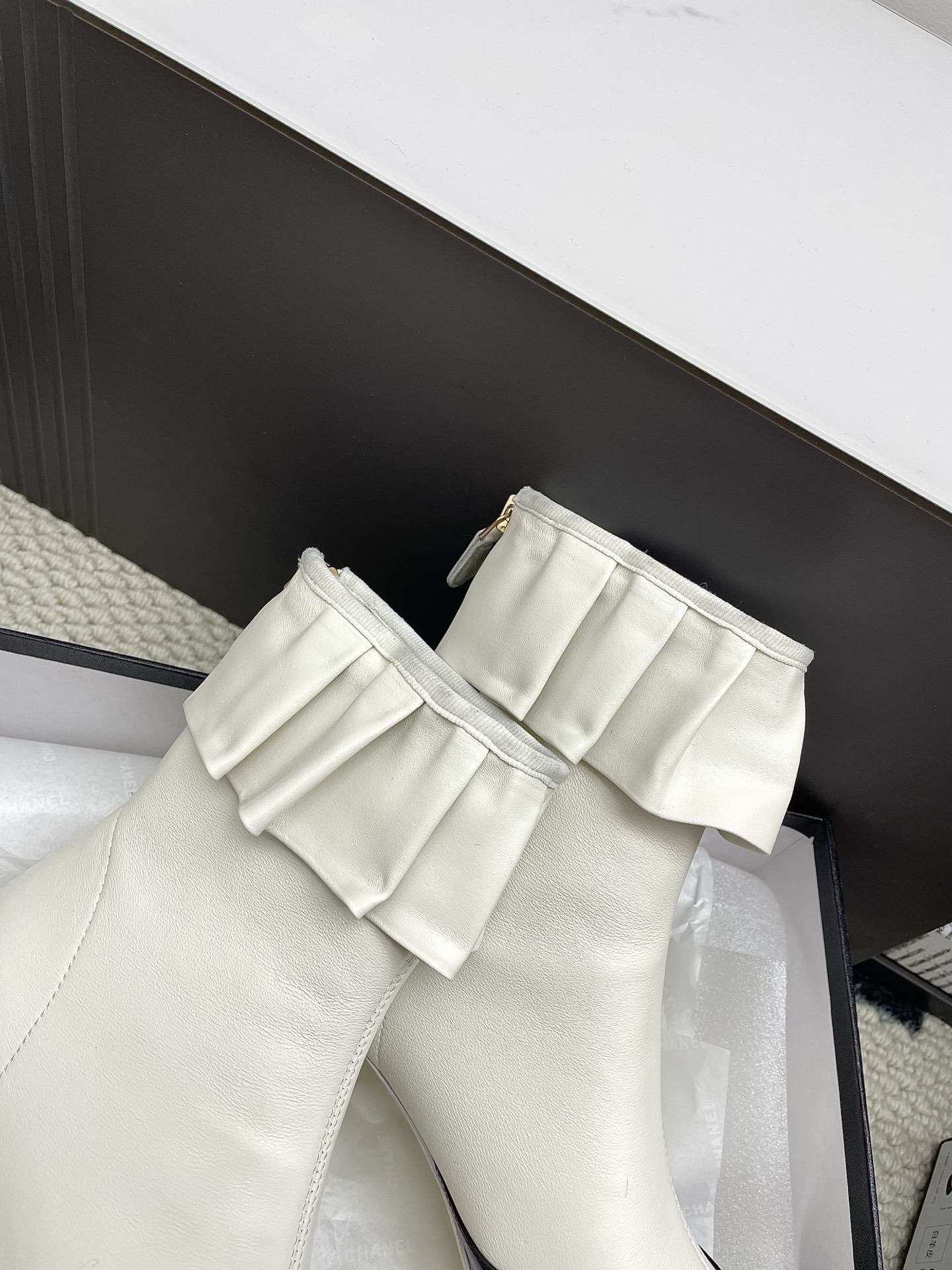 Chanel two-tone ankle boots in cream leather with black patent toe and ruffle collar detail - Hình 8