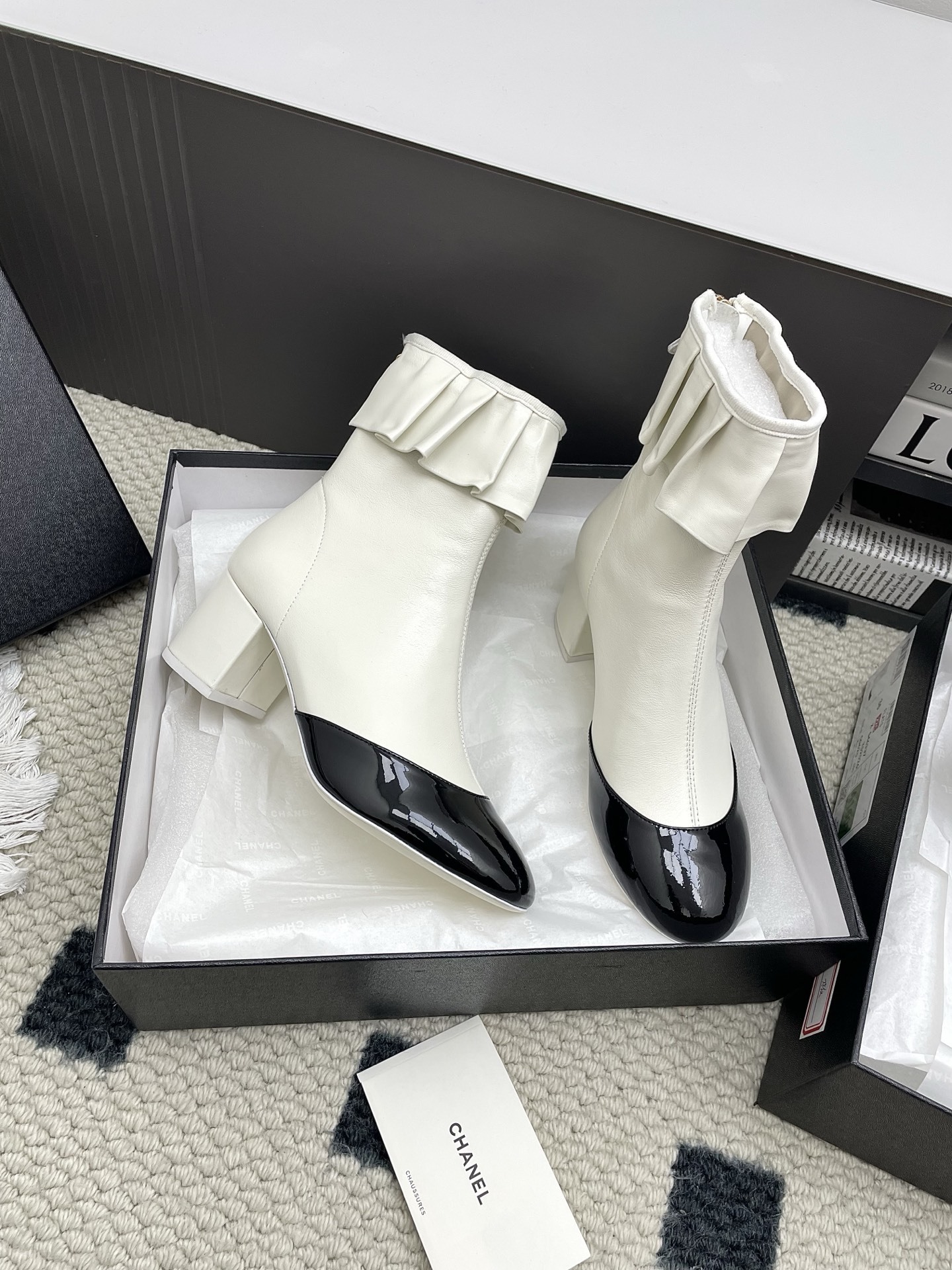 Chanel two-tone ankle boots in cream leather with black patent toe and ruffle collar detail - Hình 7