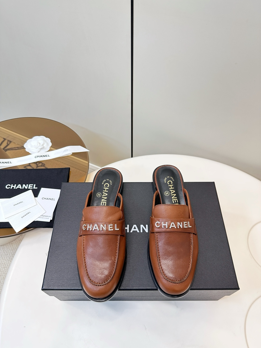 Chanel Women’s Tan Leather Crystal Logo Loafer Mules