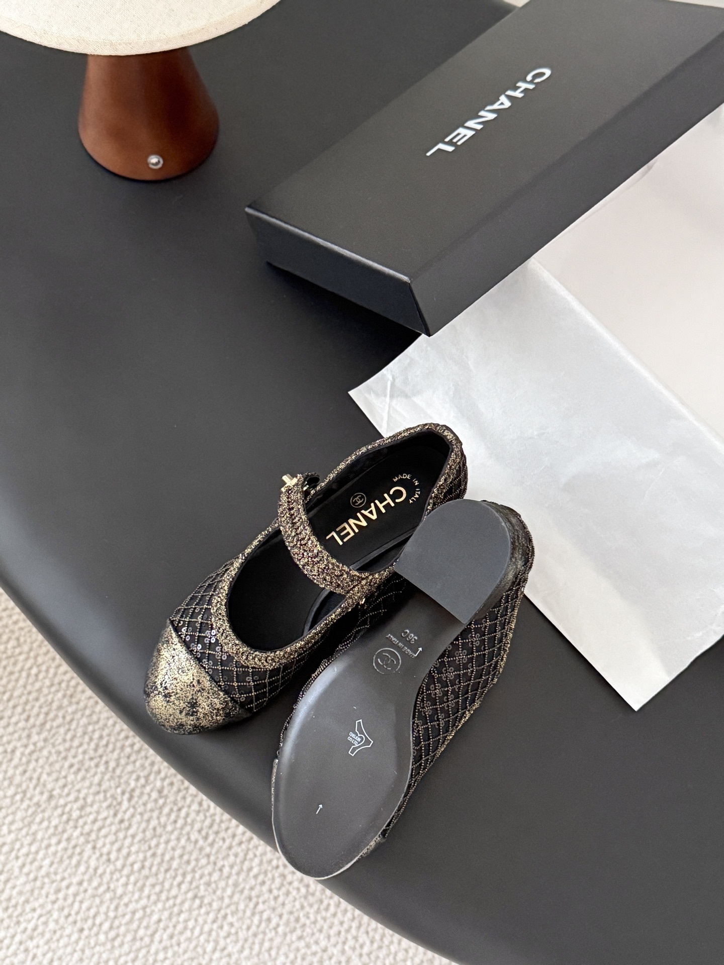 A pair of Chanel black mesh Mary Jane pumps with gold glitter quilted pattern and CC logo button detail shown with original box. - Hình 5